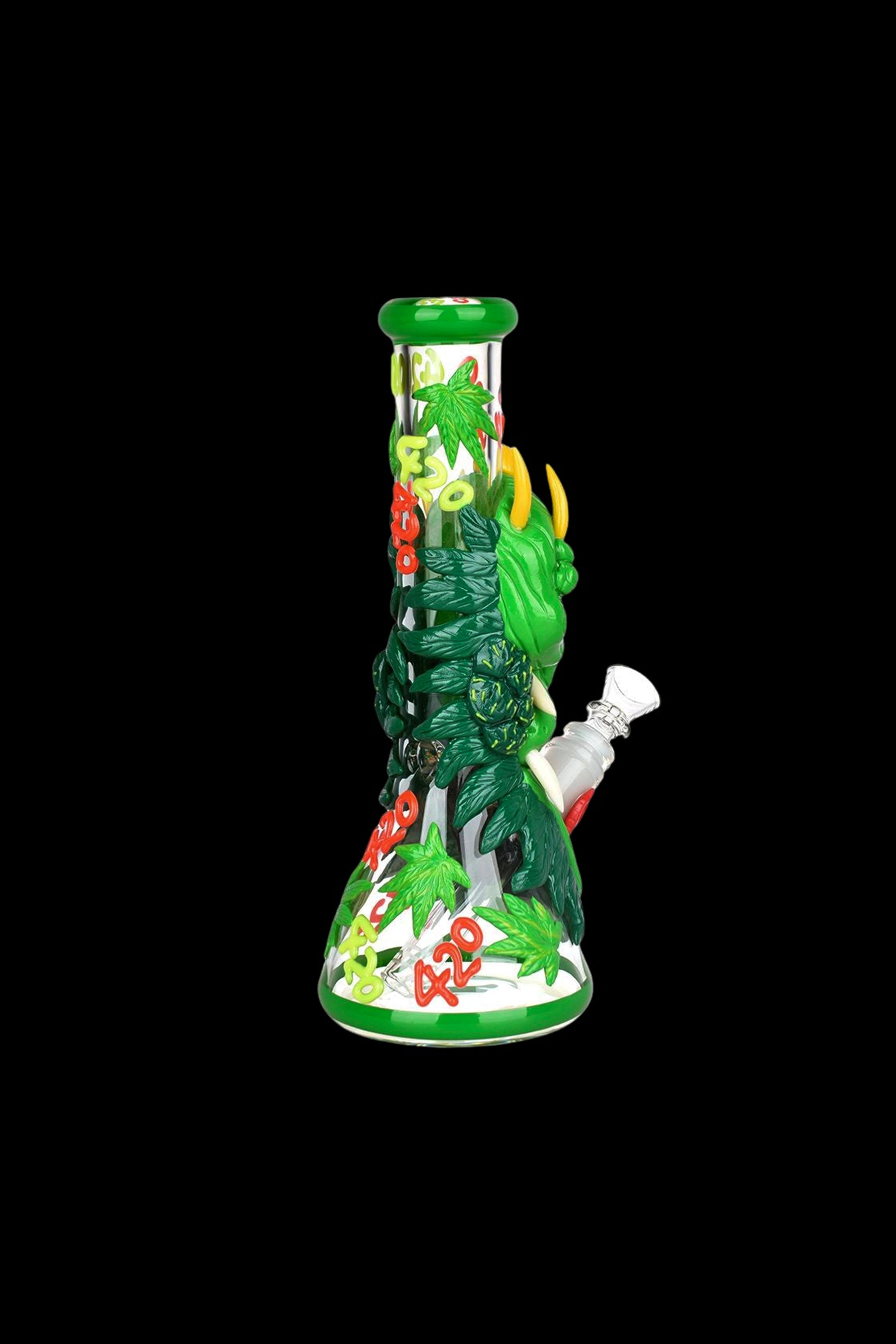 Green glass bong decorated with cannabis leaves and “420” text, isolated on a black background.