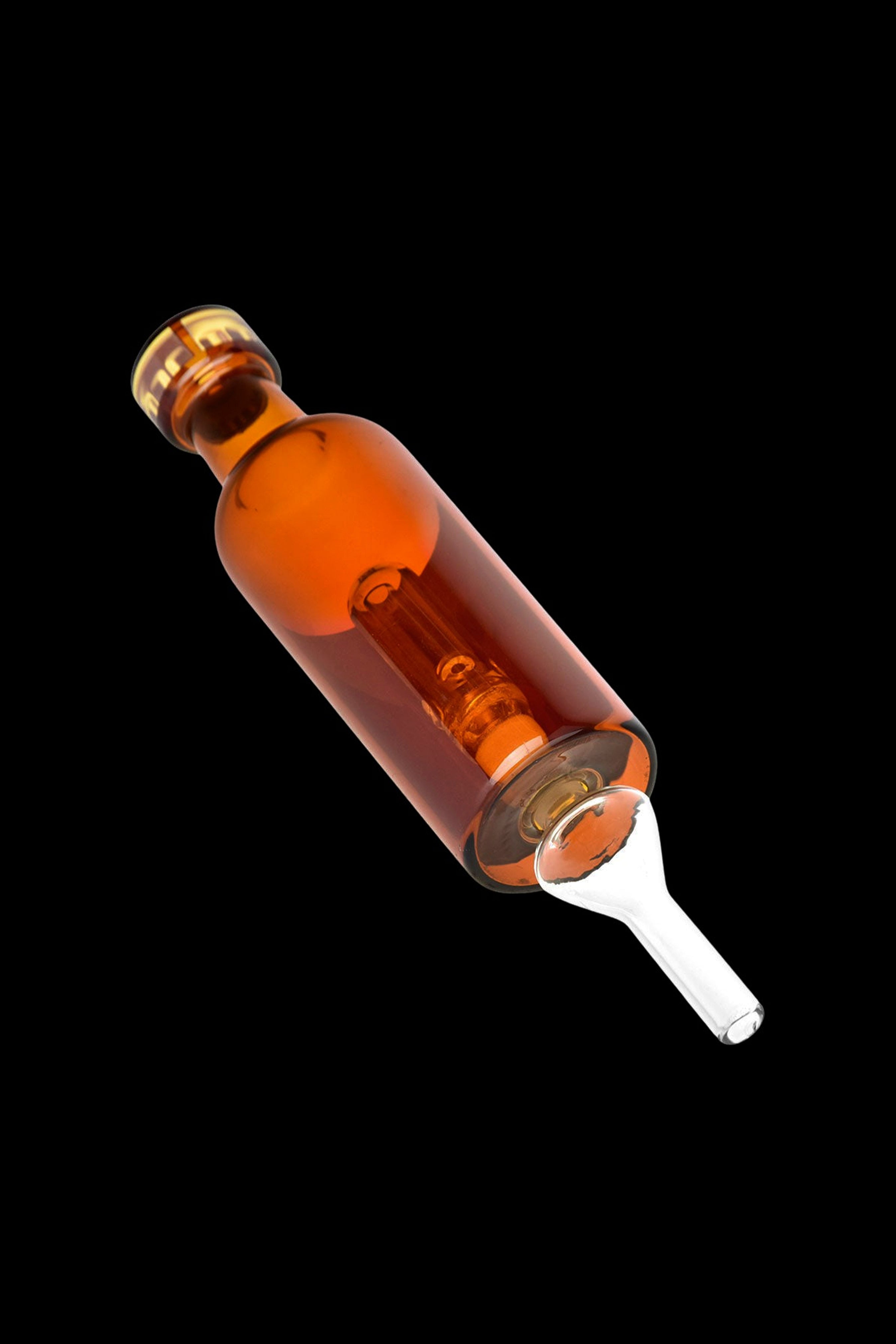Amber glass oil burner pipe for cannabis concentrates against a black background.