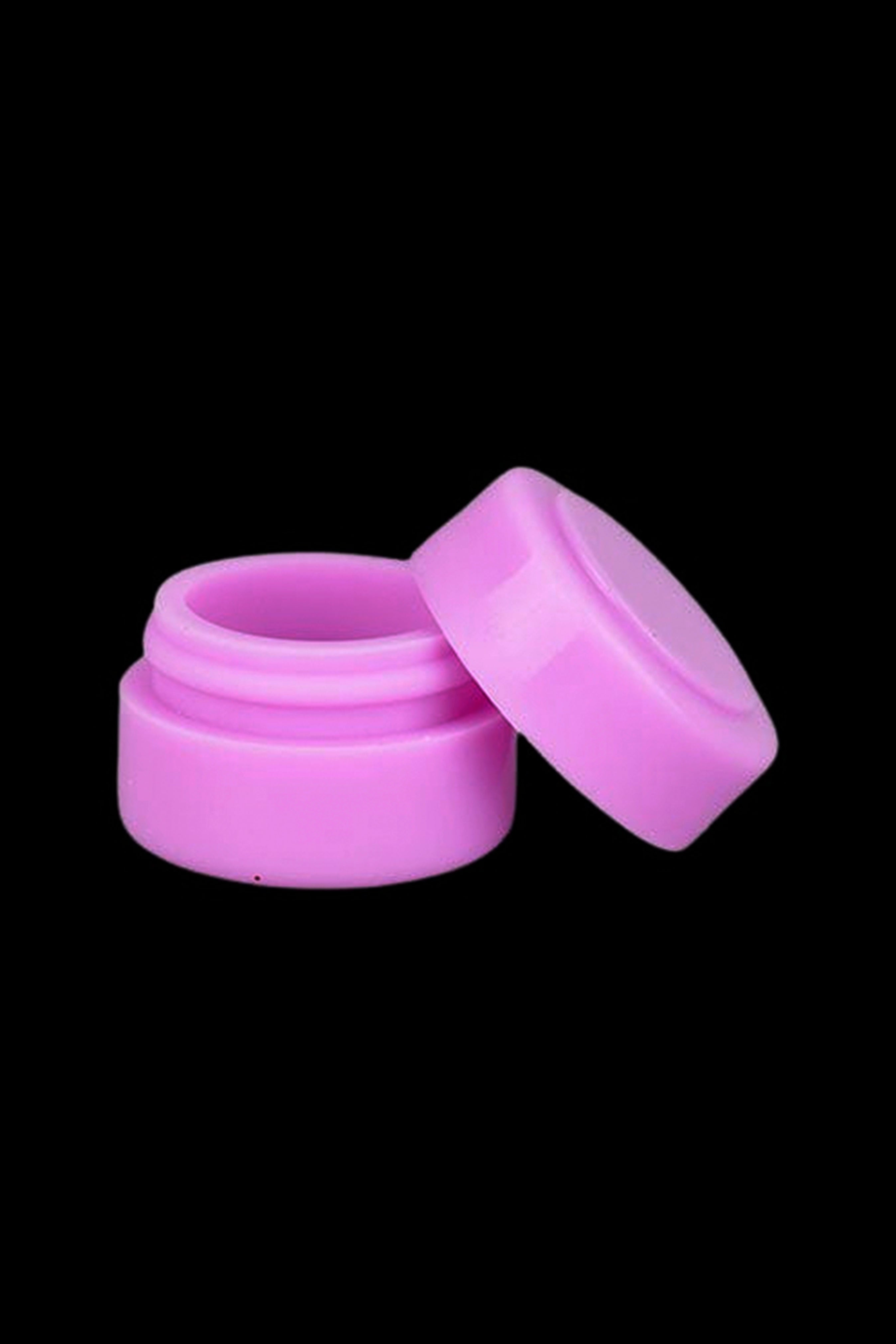 Open pink silicone concentrate container.