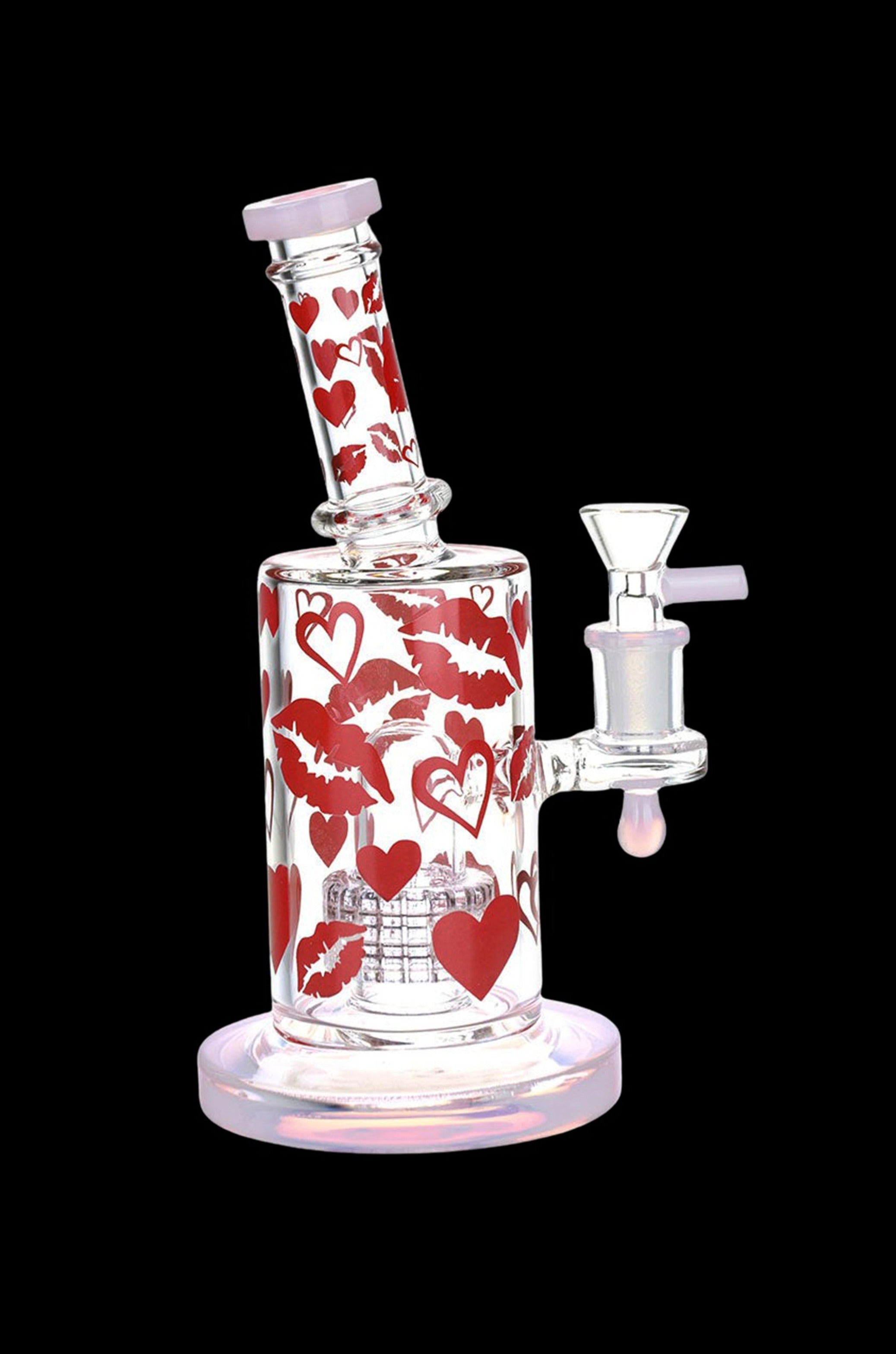 Glass water pipe decorated with red hearts and lips.