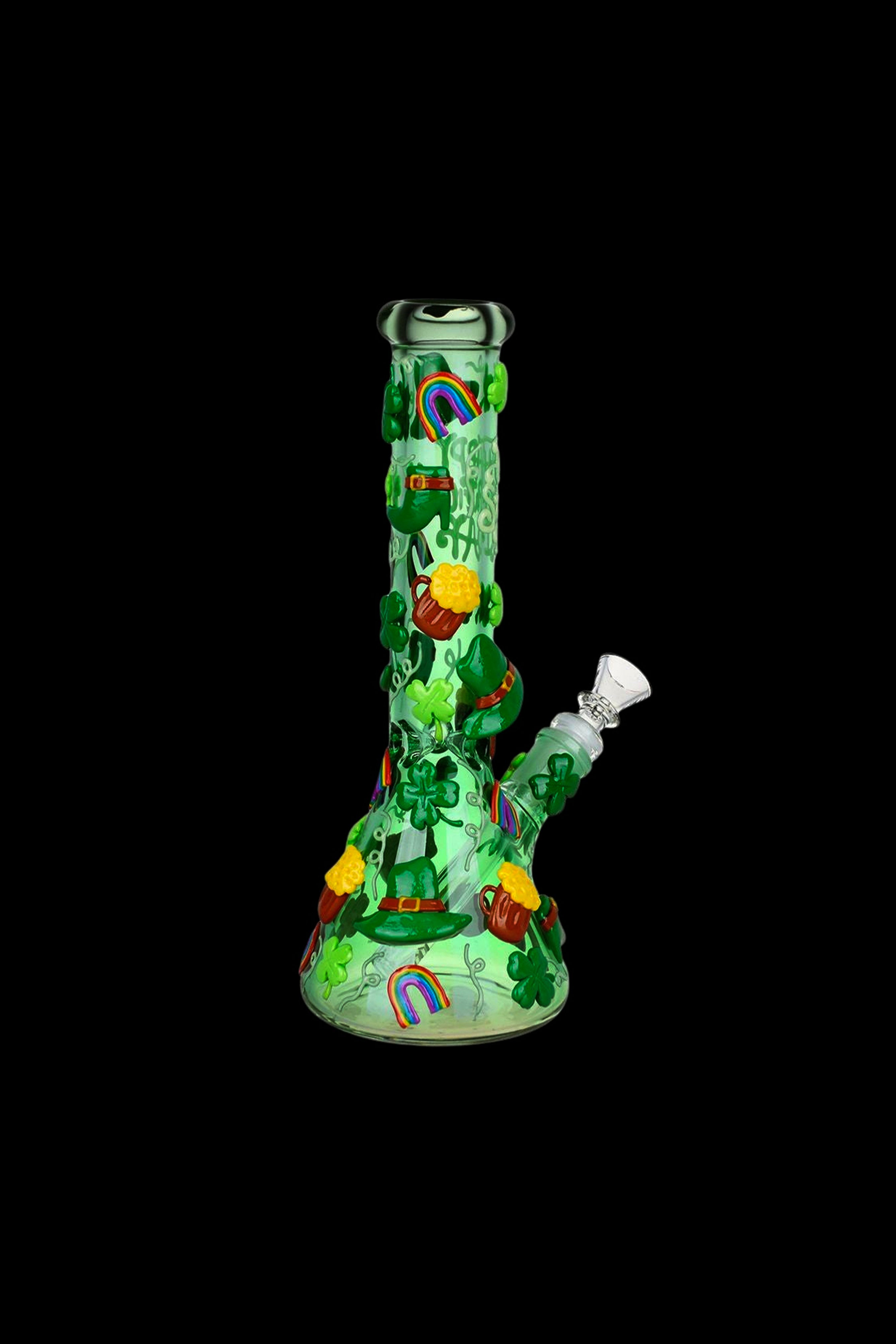 Green glass water pipe decorated with St. Patrick’s Day themed imagery, including leprechauns, shamrocks, and a rainbow, against a black background.