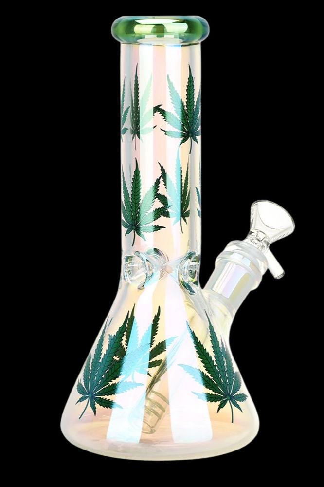 Glass bong with cannabis leaf patterns and iridescent finish.