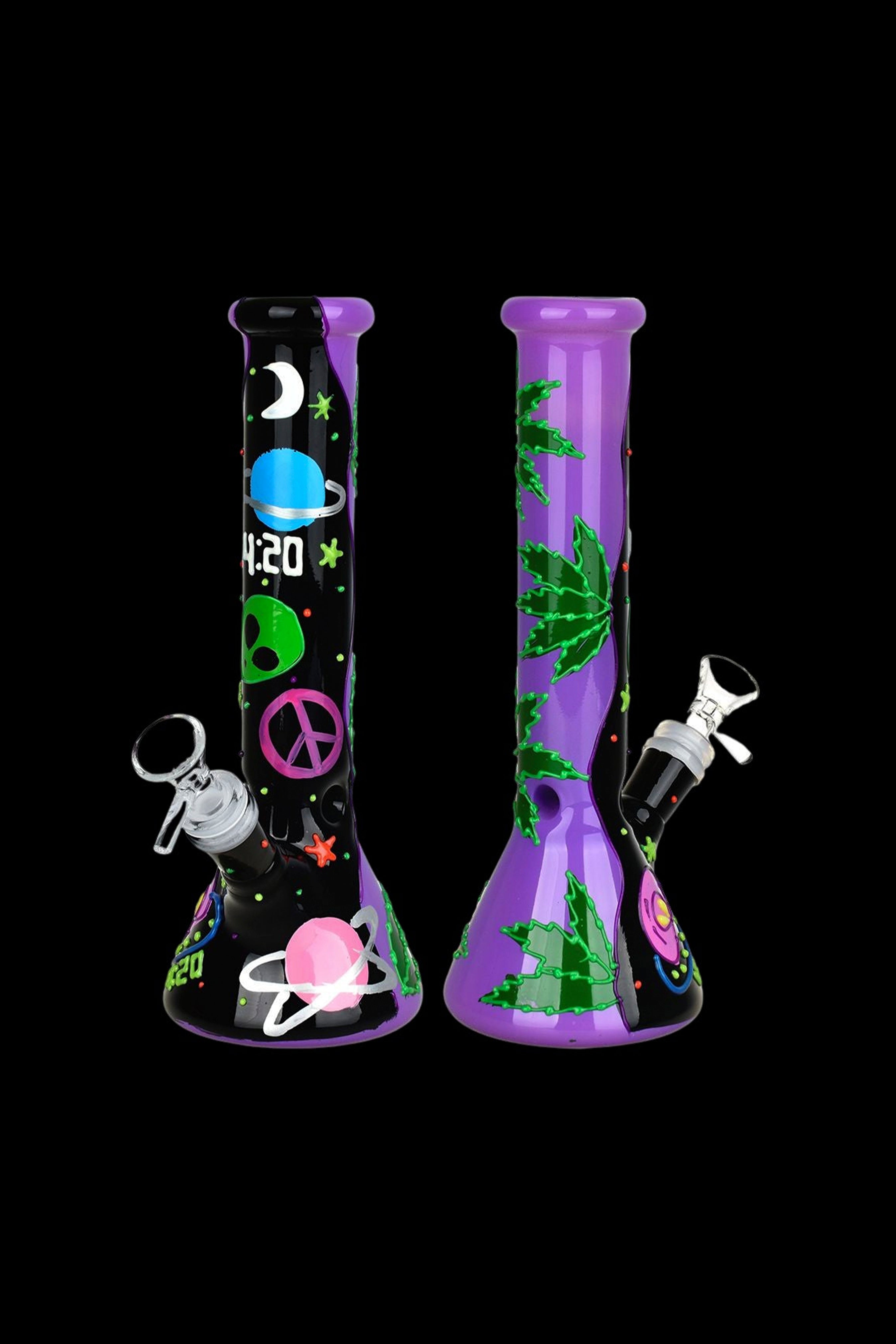 Purple glass bong with cosmic and cannabis-themed decals against a black background.