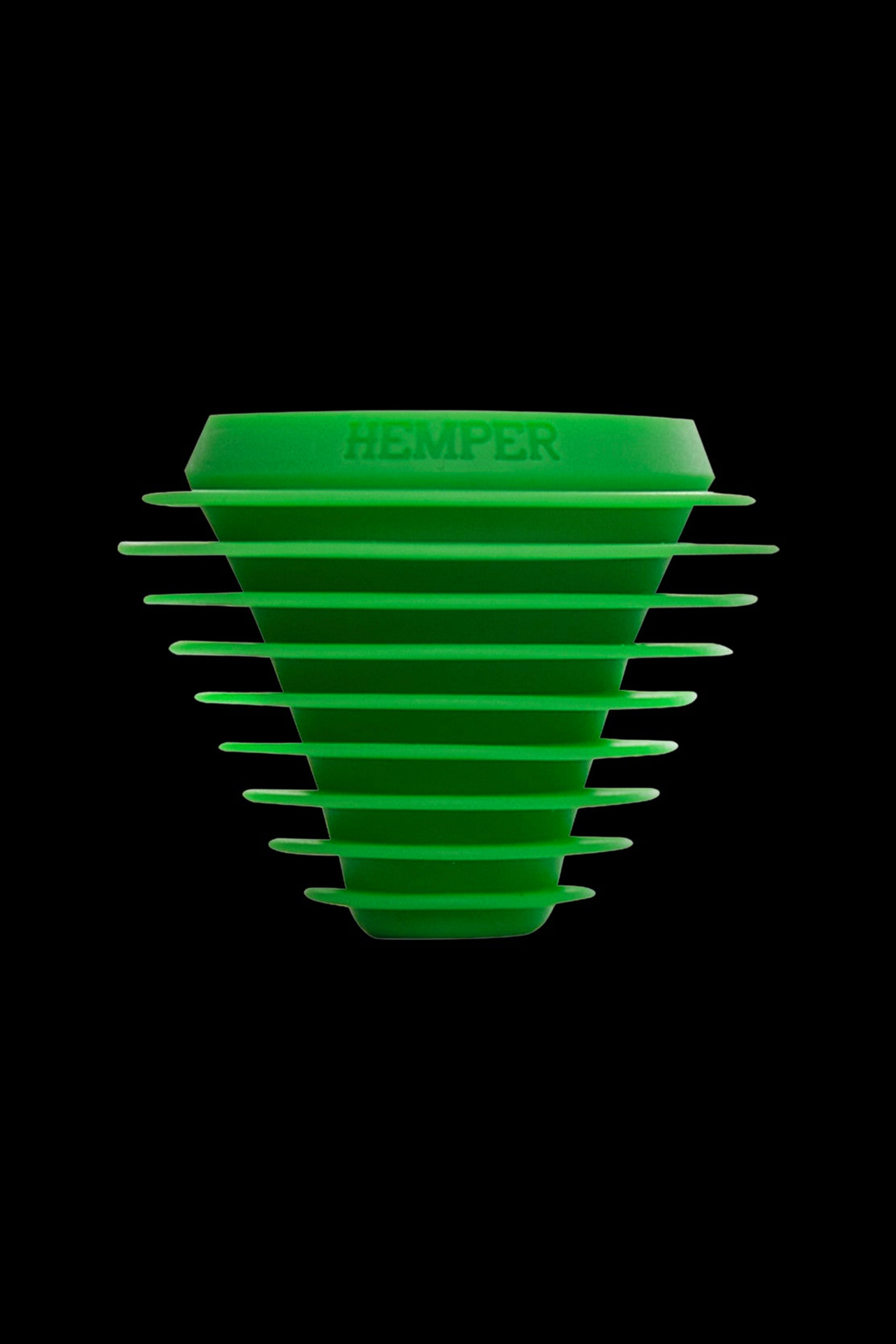 Green silicone hash oil collection tip with "HEMPER" logo, isolated on black.
