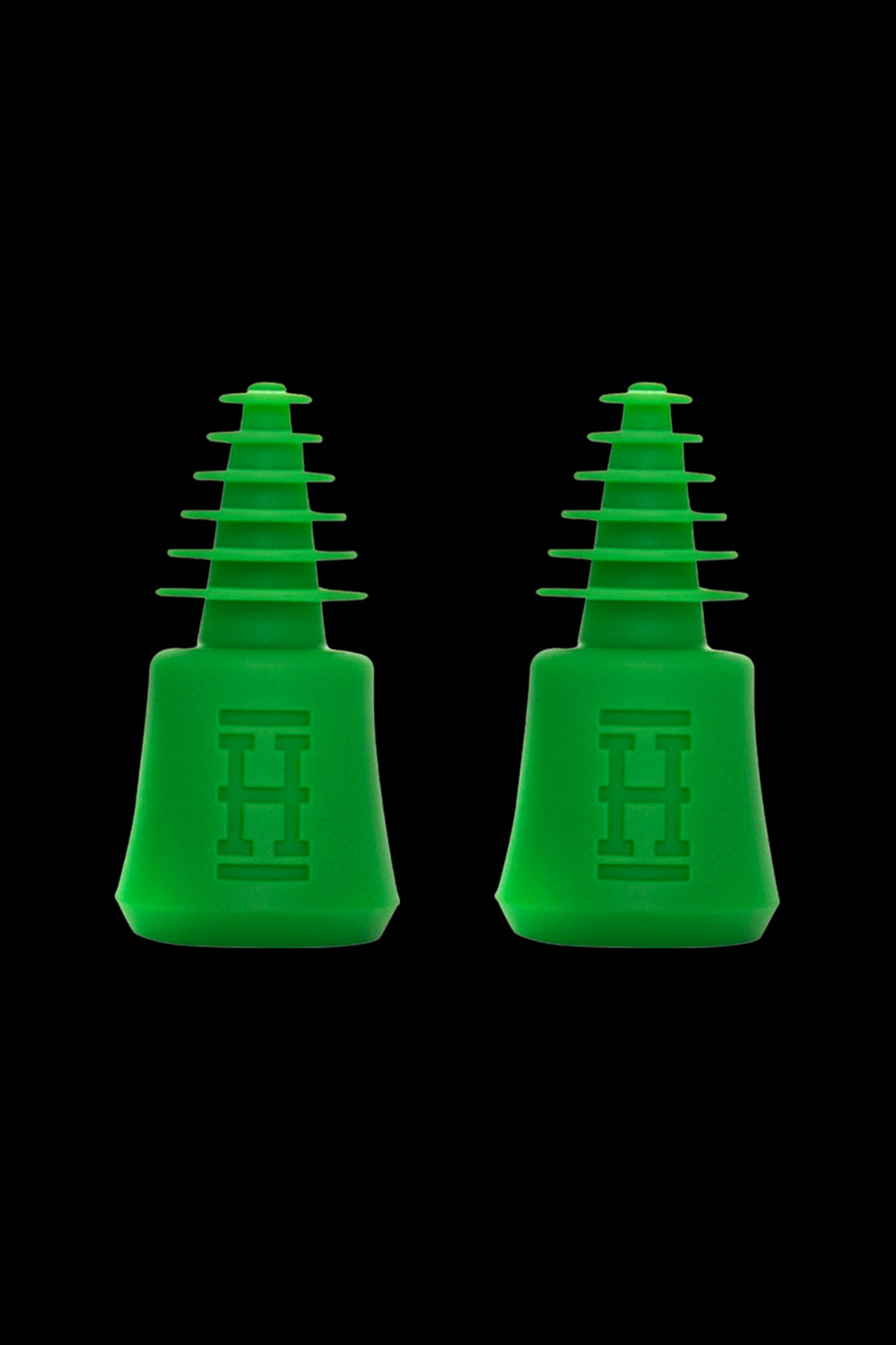 Two green silicone hash oil rig tips for dabbing cannabis concentrates.