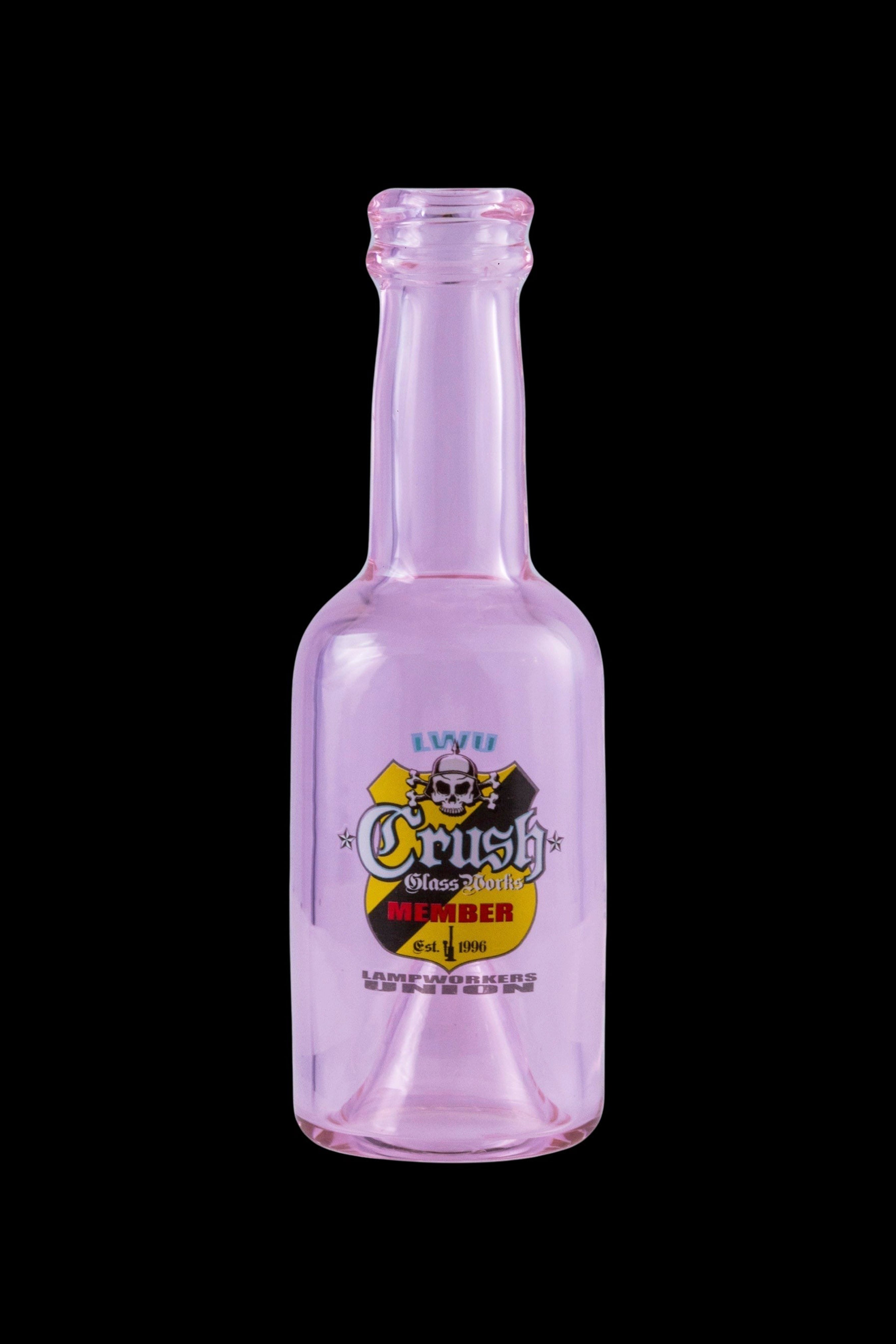 Pink glass bottle with “Crush Glass” branding and skull graphic, likely for cannabis concentrates.
