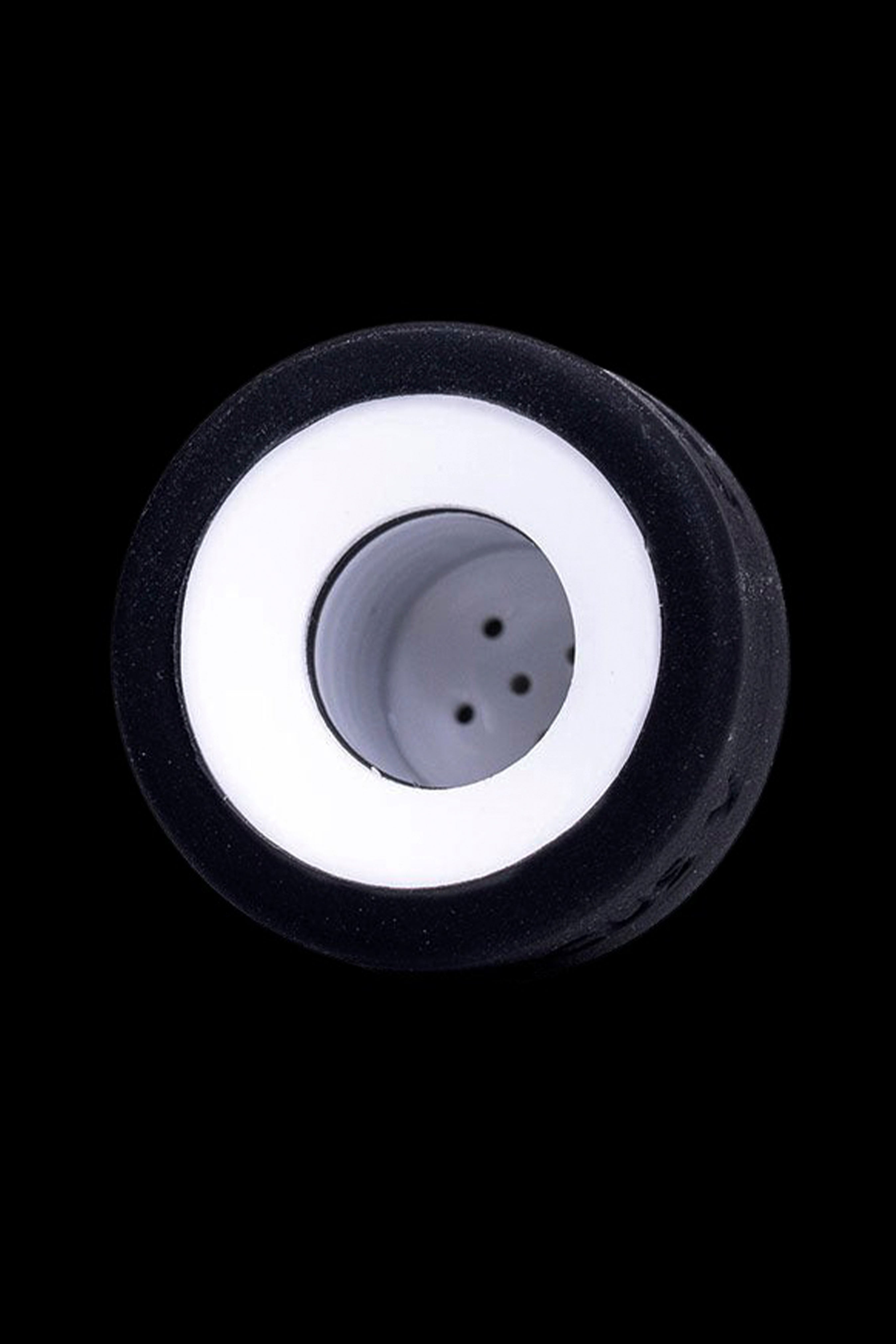 Close-up of a black cannabis pipe bowl with a white ring and multiple air holes.