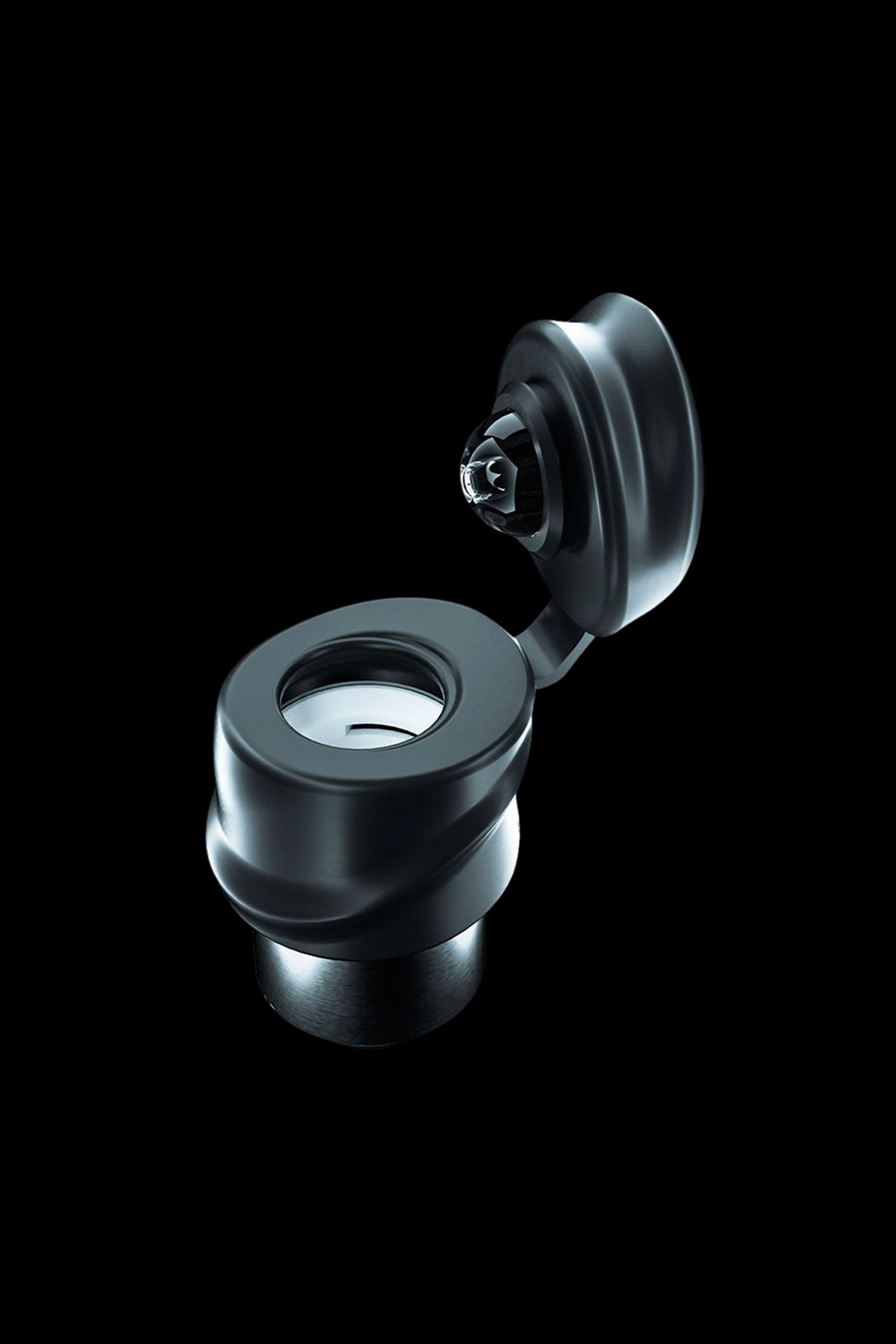 Black cannabis oil vape cartridge and magnetic attachment.