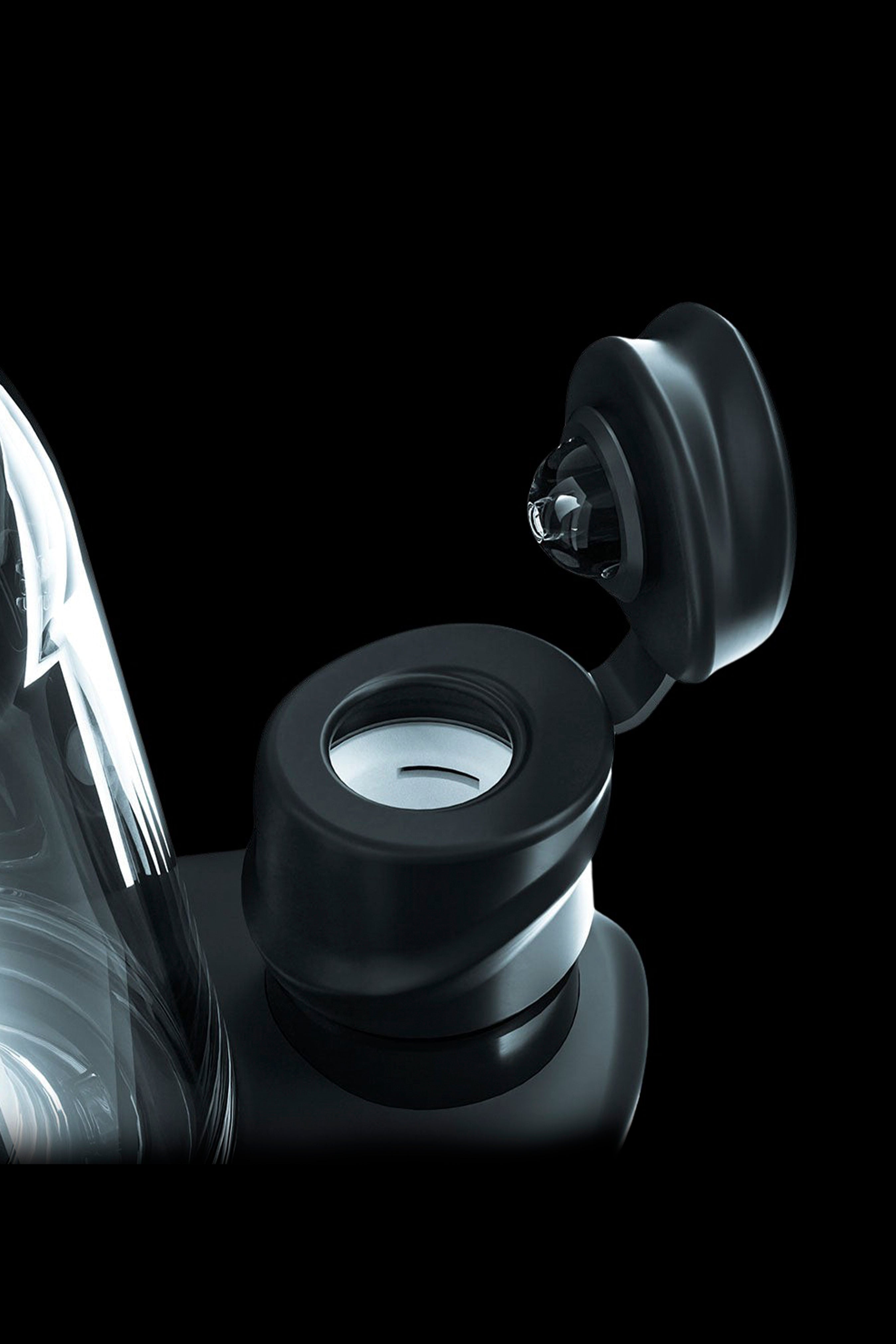 Close-up of a sleek, black cannabis oil vape pen cartridge with an open mouthpiece.