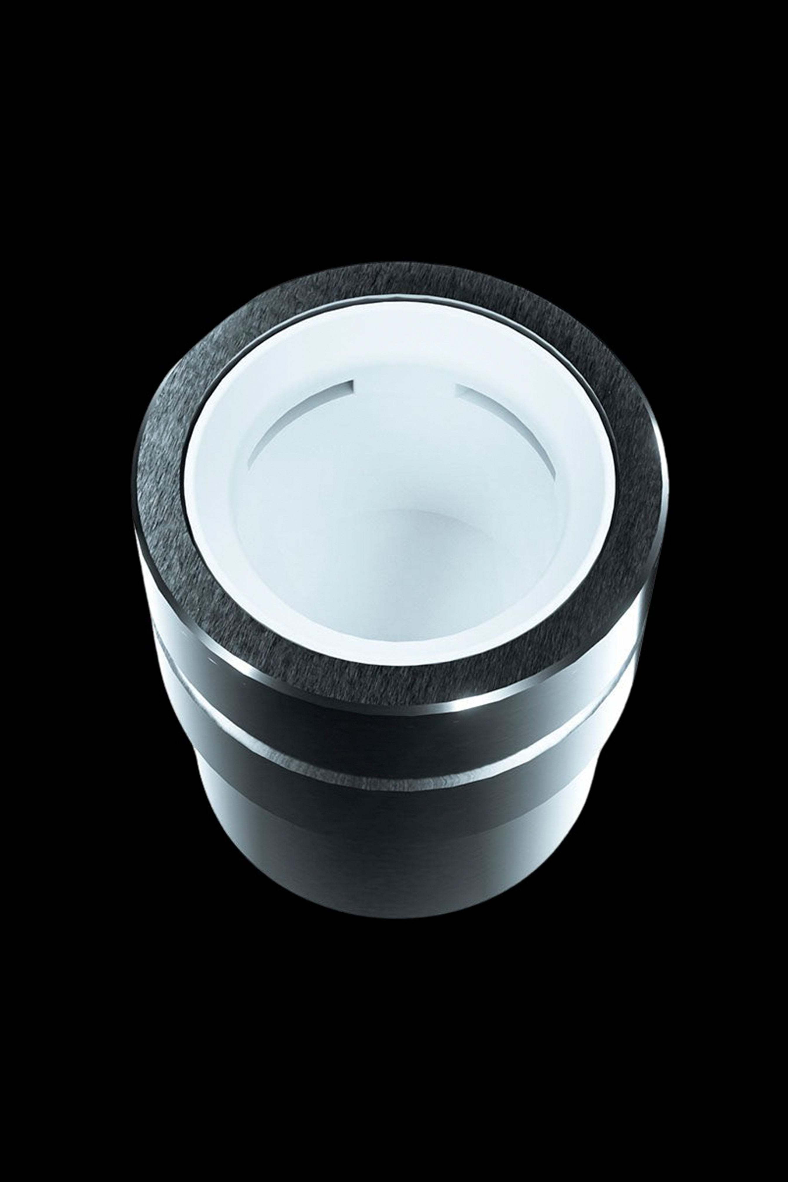 Silver and black cannabis grinder, top view.