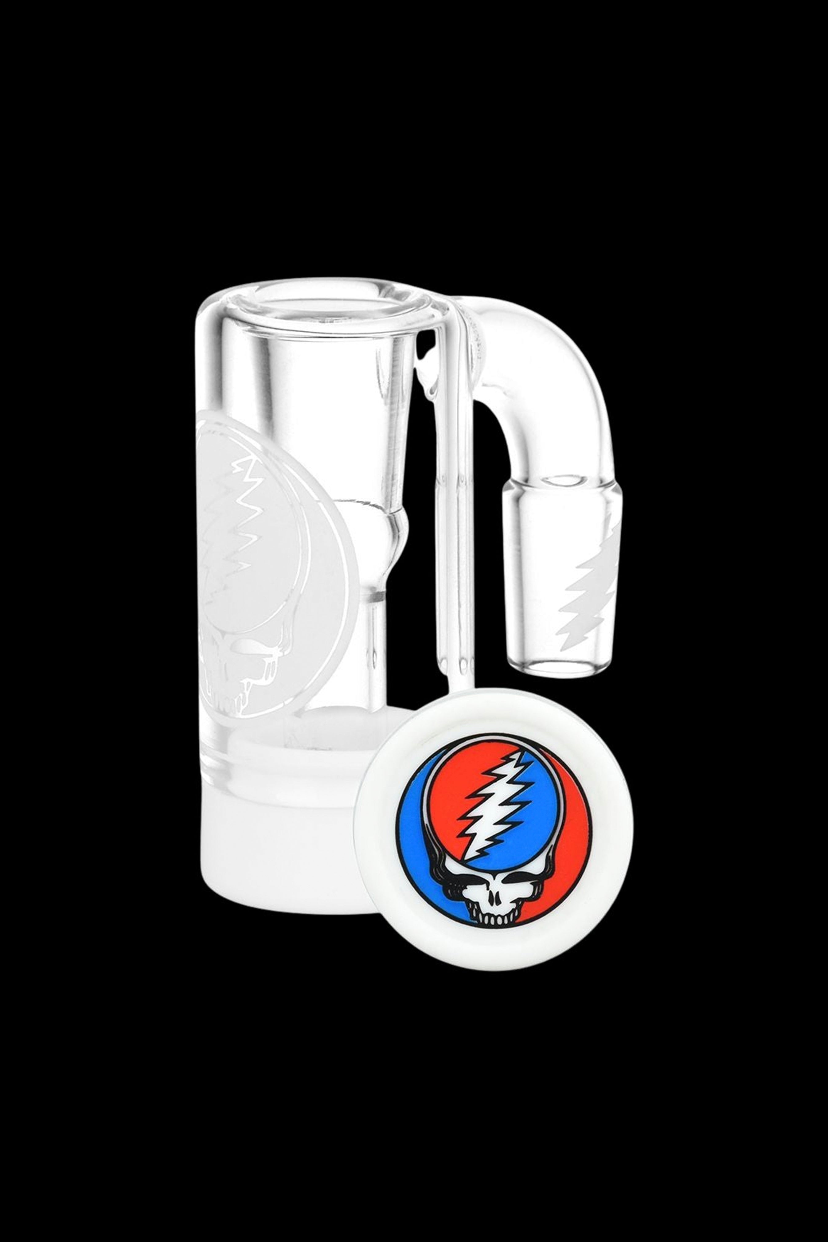Clear glass bubbler water pipe with a Steal Your Face Grateful Dead sticker.