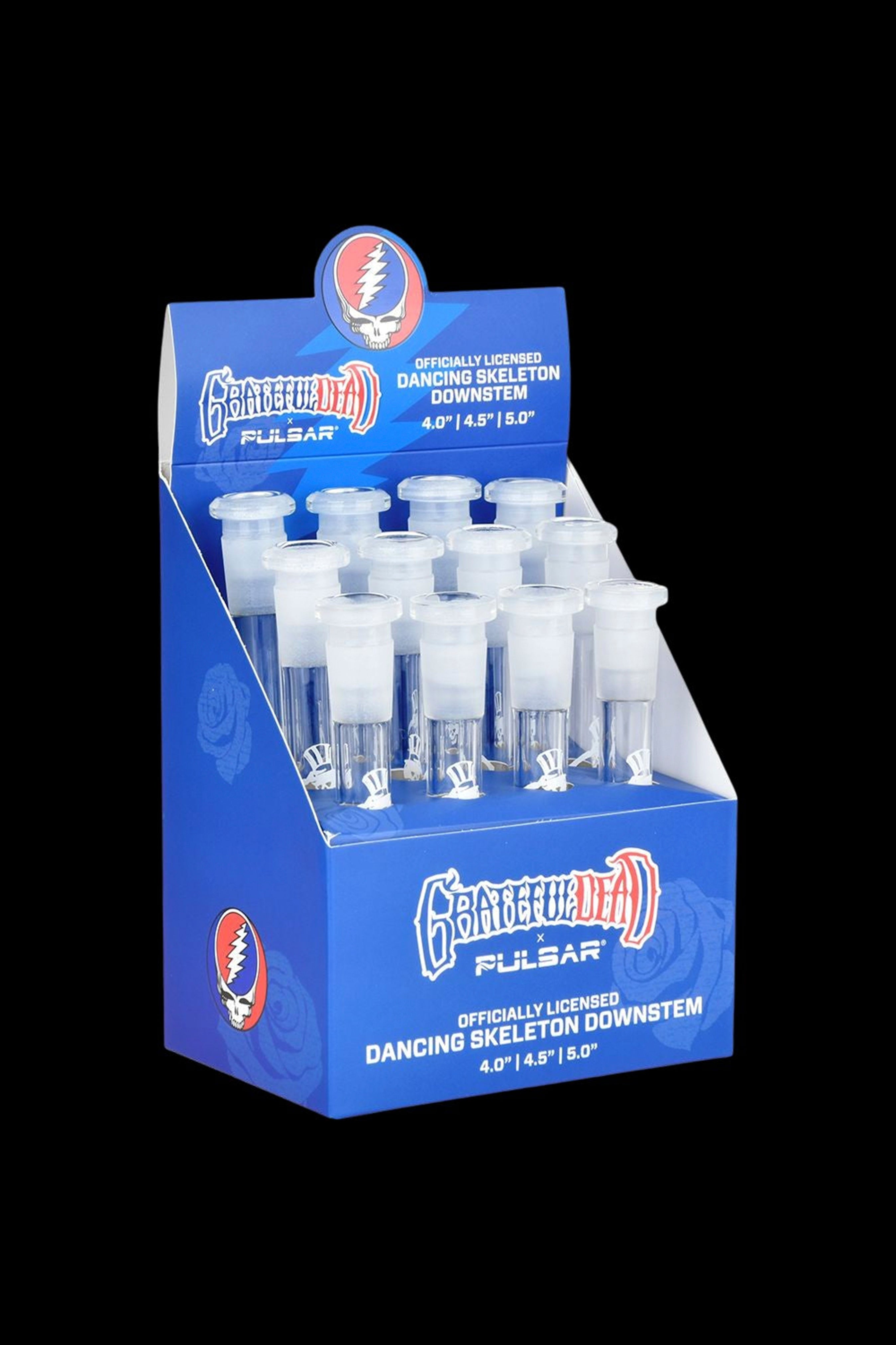 Display box of officially licensed Grateful Dead Pulsar downstems for water pipes, featuring a dancing skeleton design.
