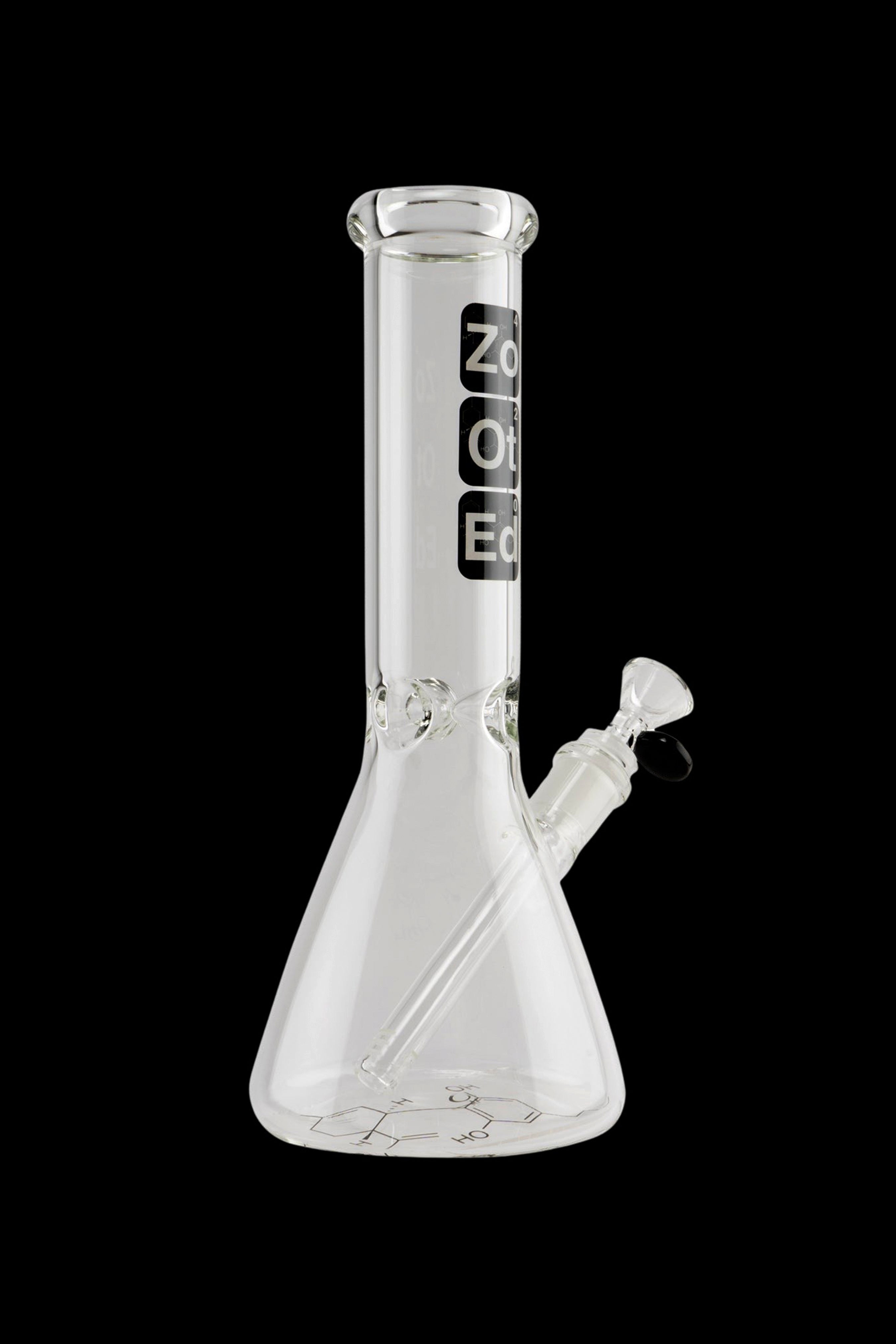 Clear glass bong with branding and intricate etched design.