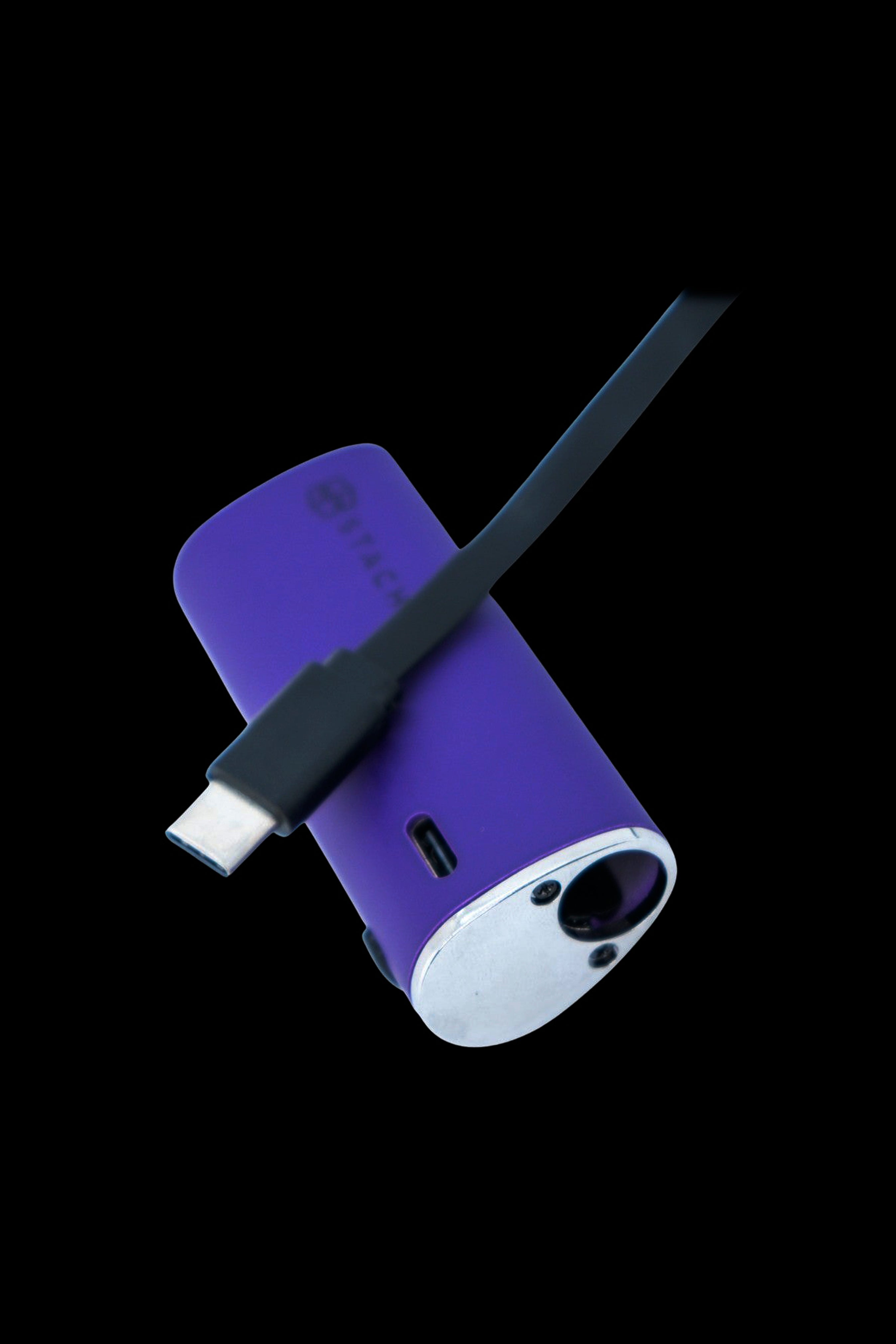 Purple and white cannabis vaporizer with a USB-C charging cable.