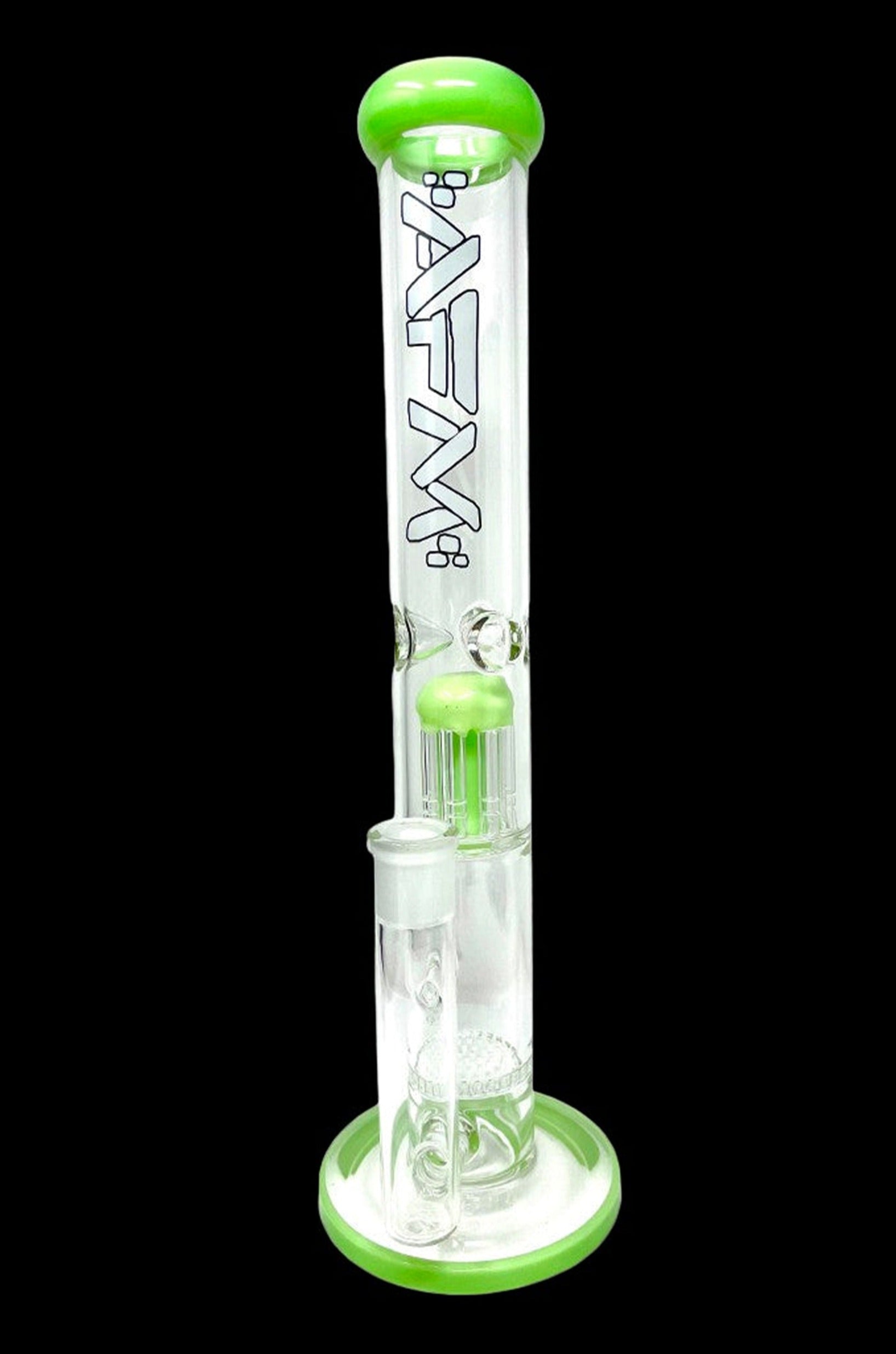 Green glass water pipe (bong) with multiple percolators, isolated on a black background.