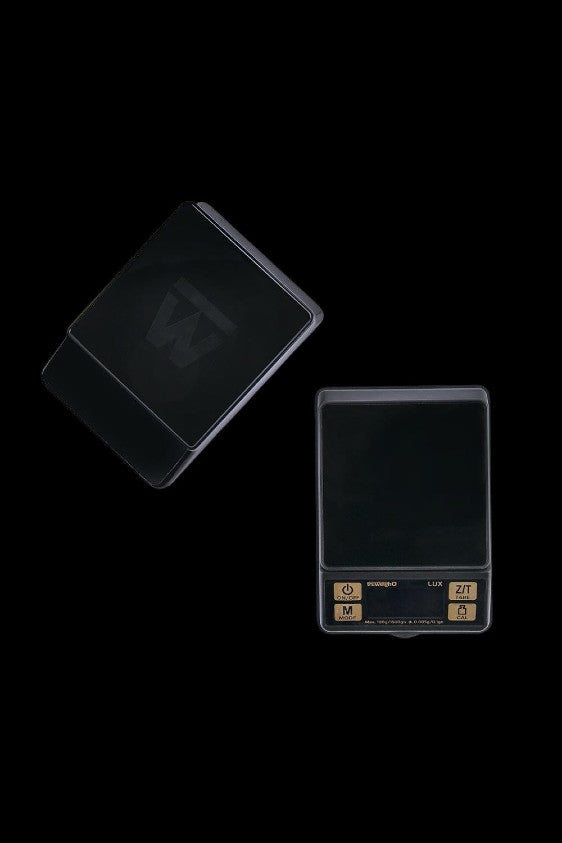Black digital scale with a reflective surface, often used for measuring cannabis.