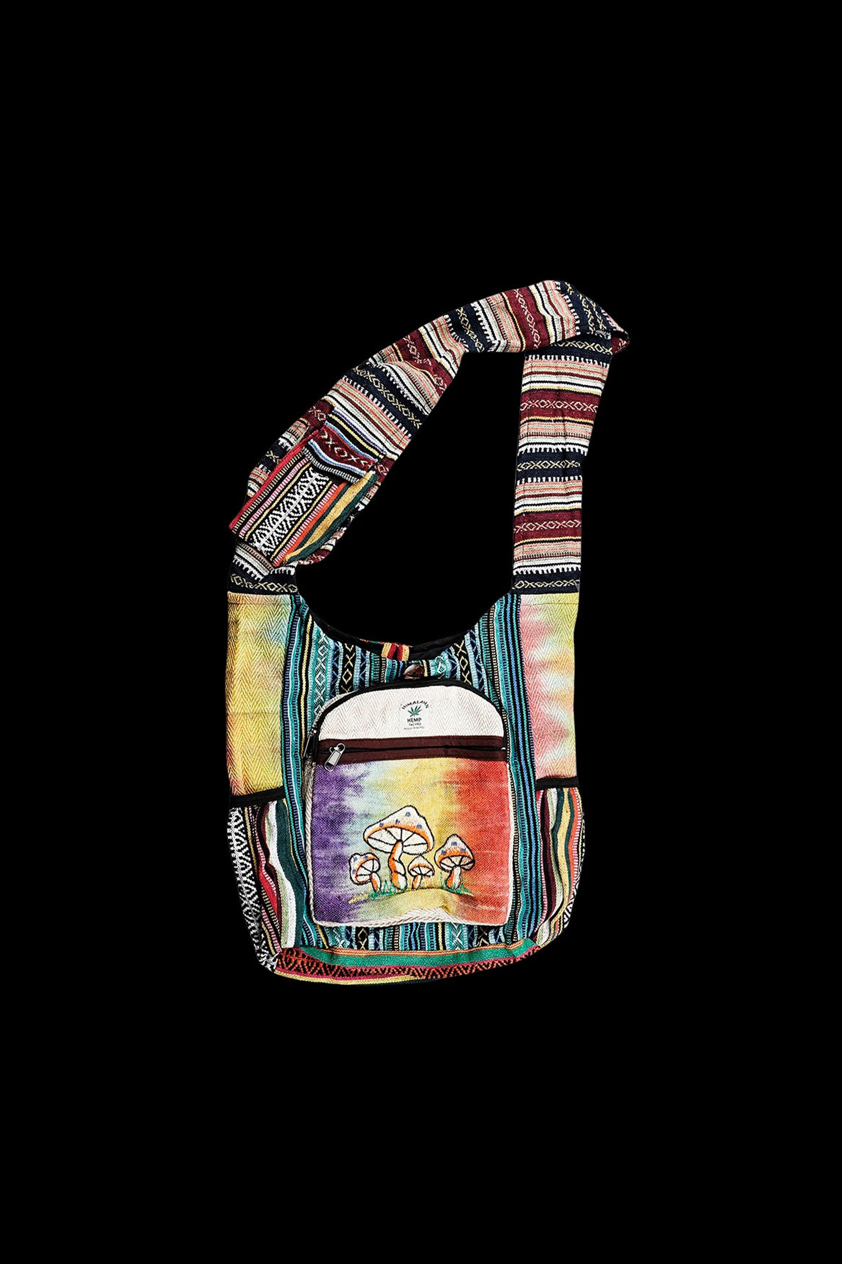 Bohemian-style shoulder bag with colorful geometric patterns and a cannabis leaf design.