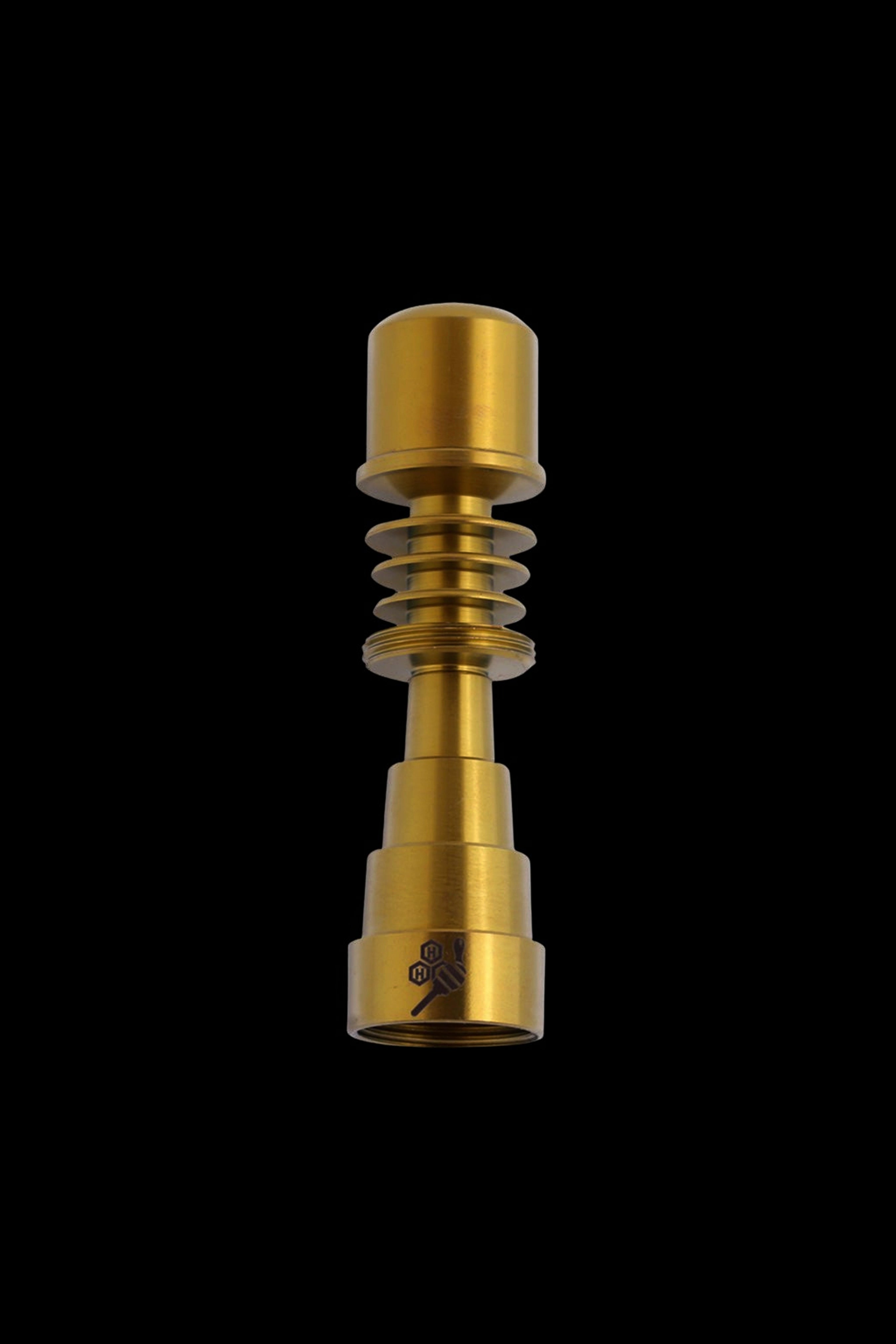 Gold cannabis concentrate vaporizer nail with ribbed design on black background.
