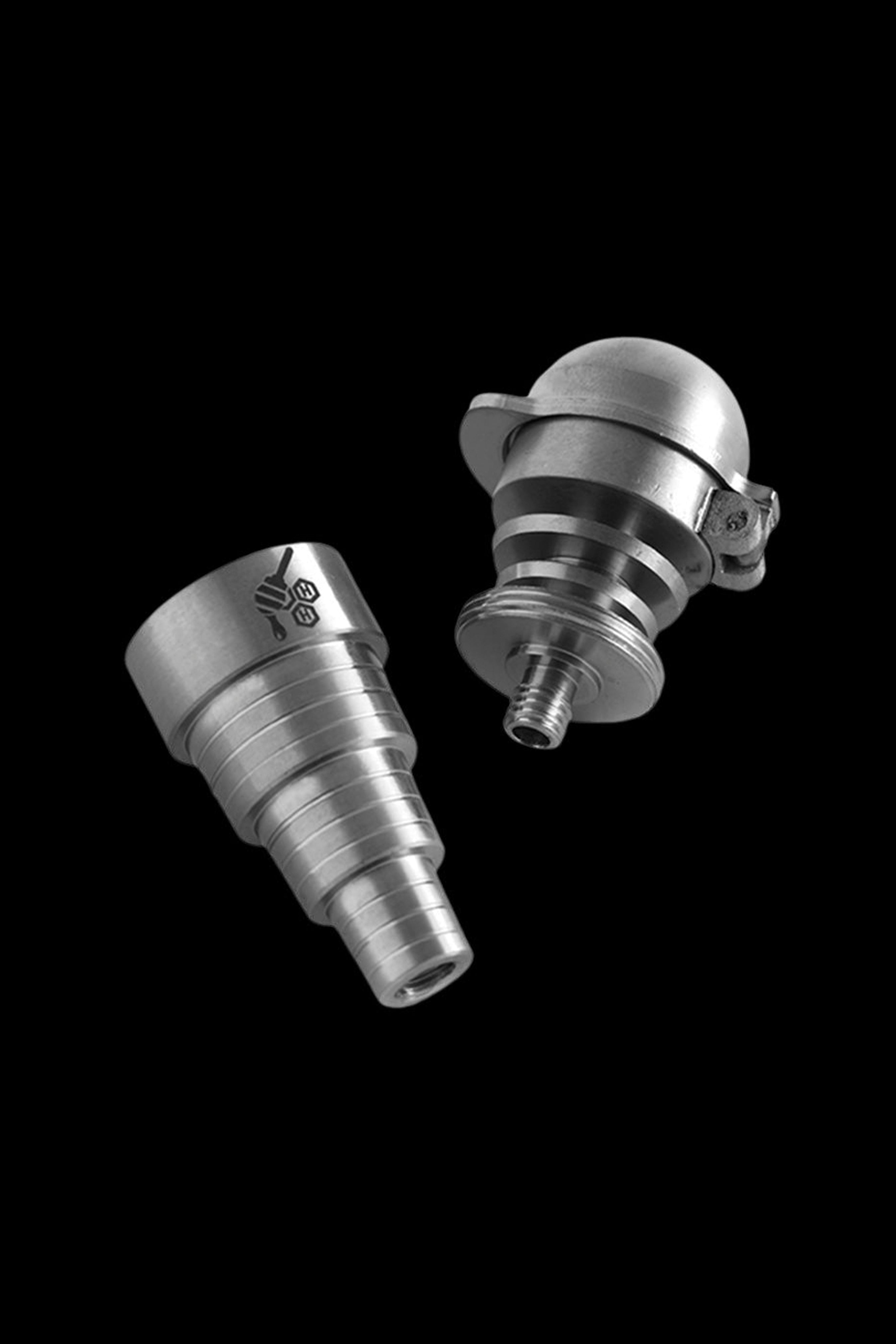 Silver cannabis dab rig attachments floating against a black background.