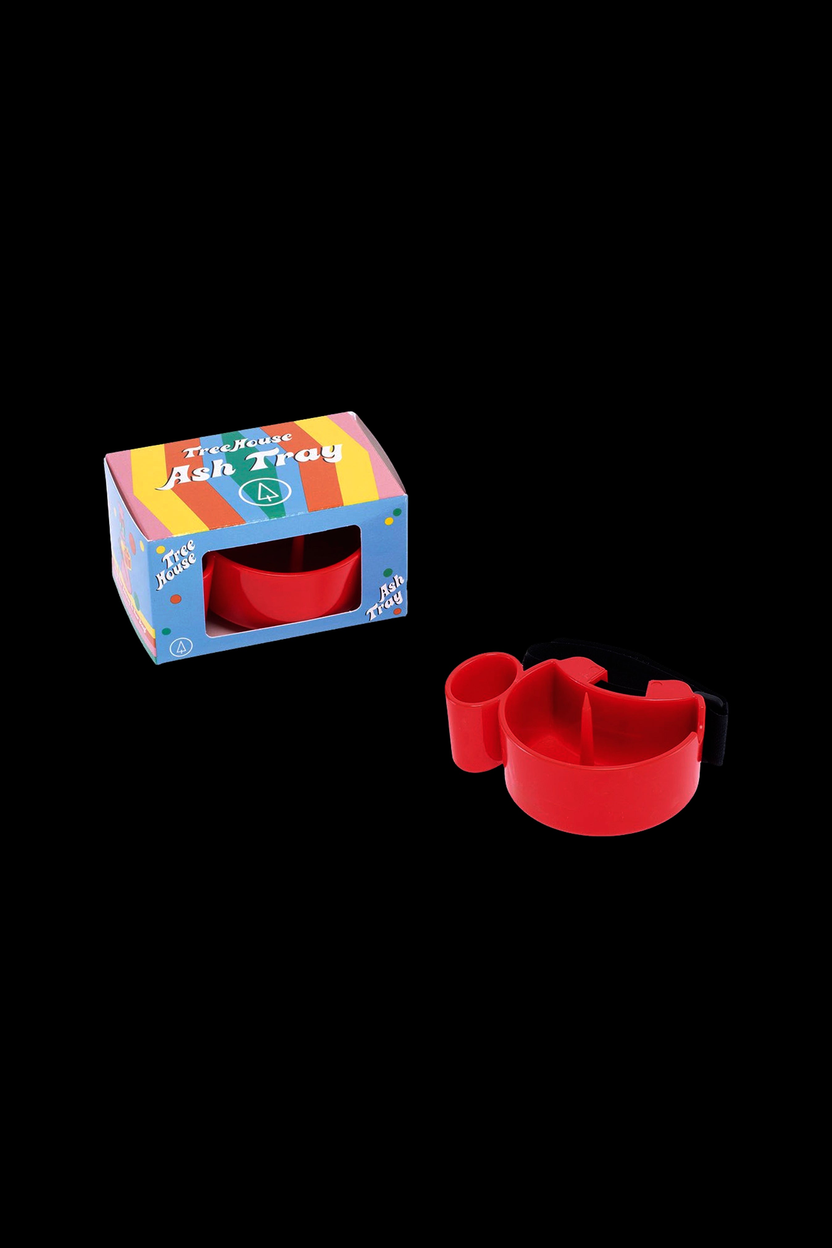 Red plastic ashtray and its packaging, branded "Treehouse Ash Tray."