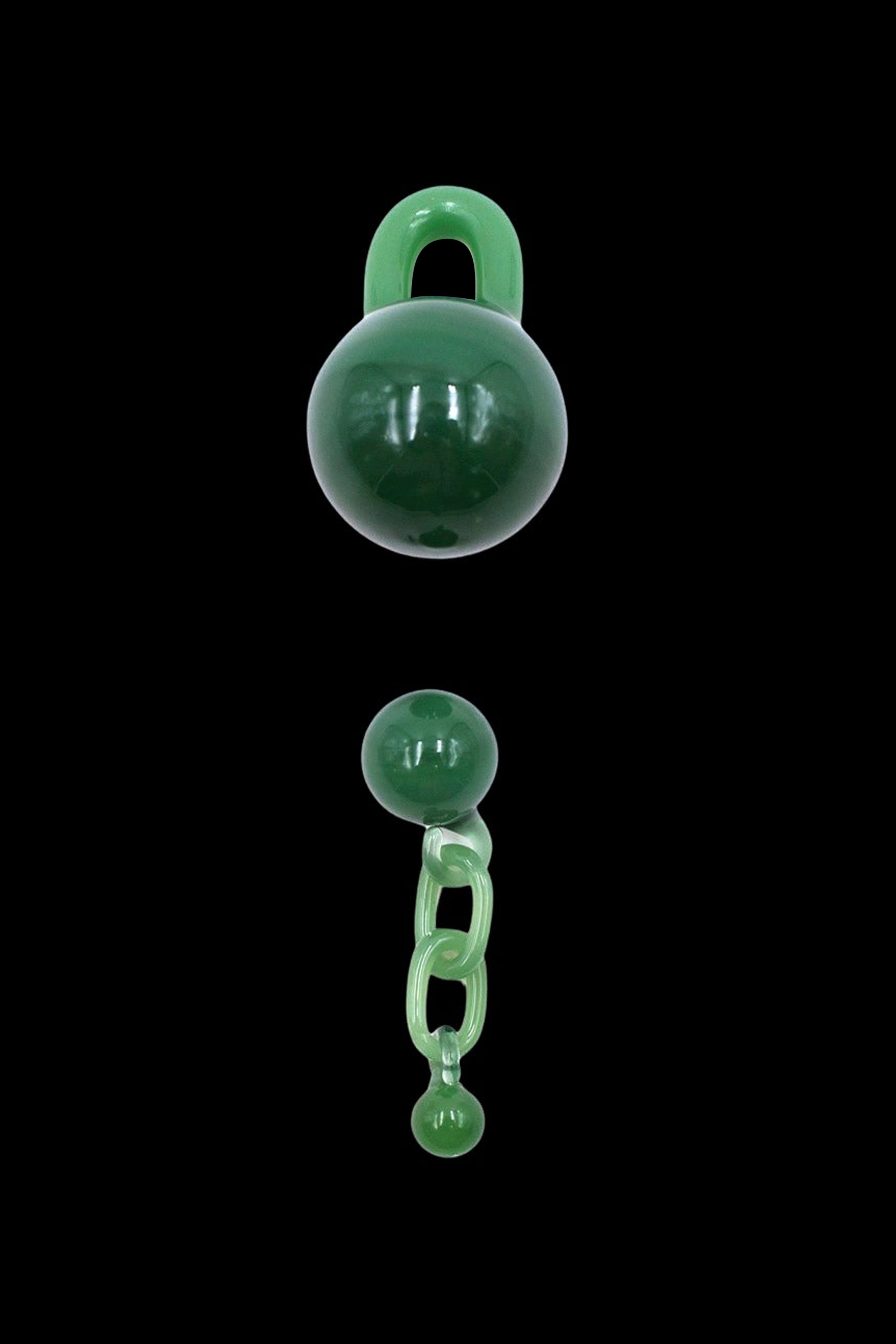 Emerald green glass lock and chain cannabis accessory against a black background.