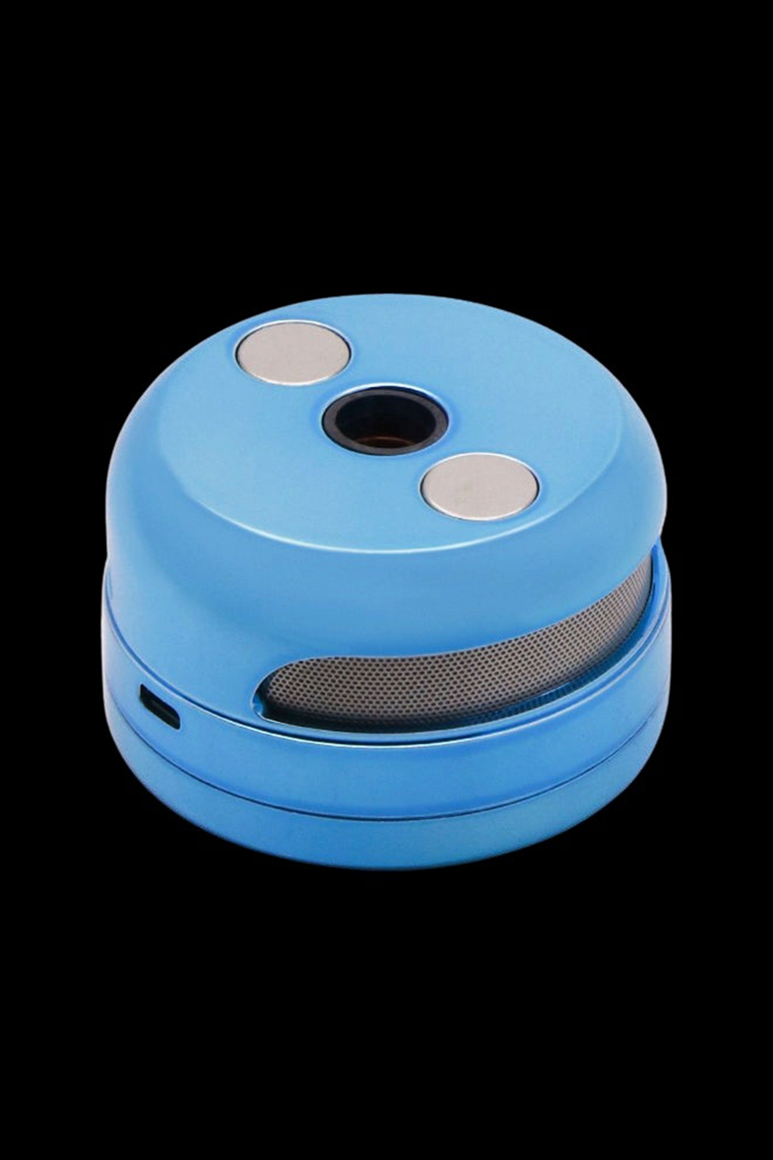 Blue cannabis grinder with metallic buttons and mesh filter.