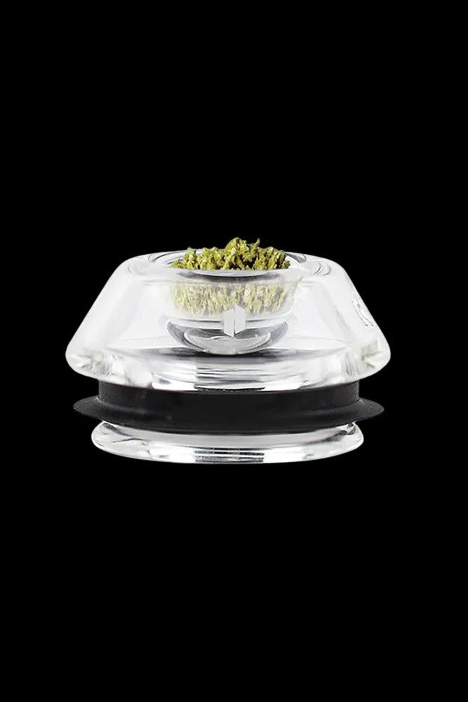 Clear glass bubbler filled with cannabis flower.