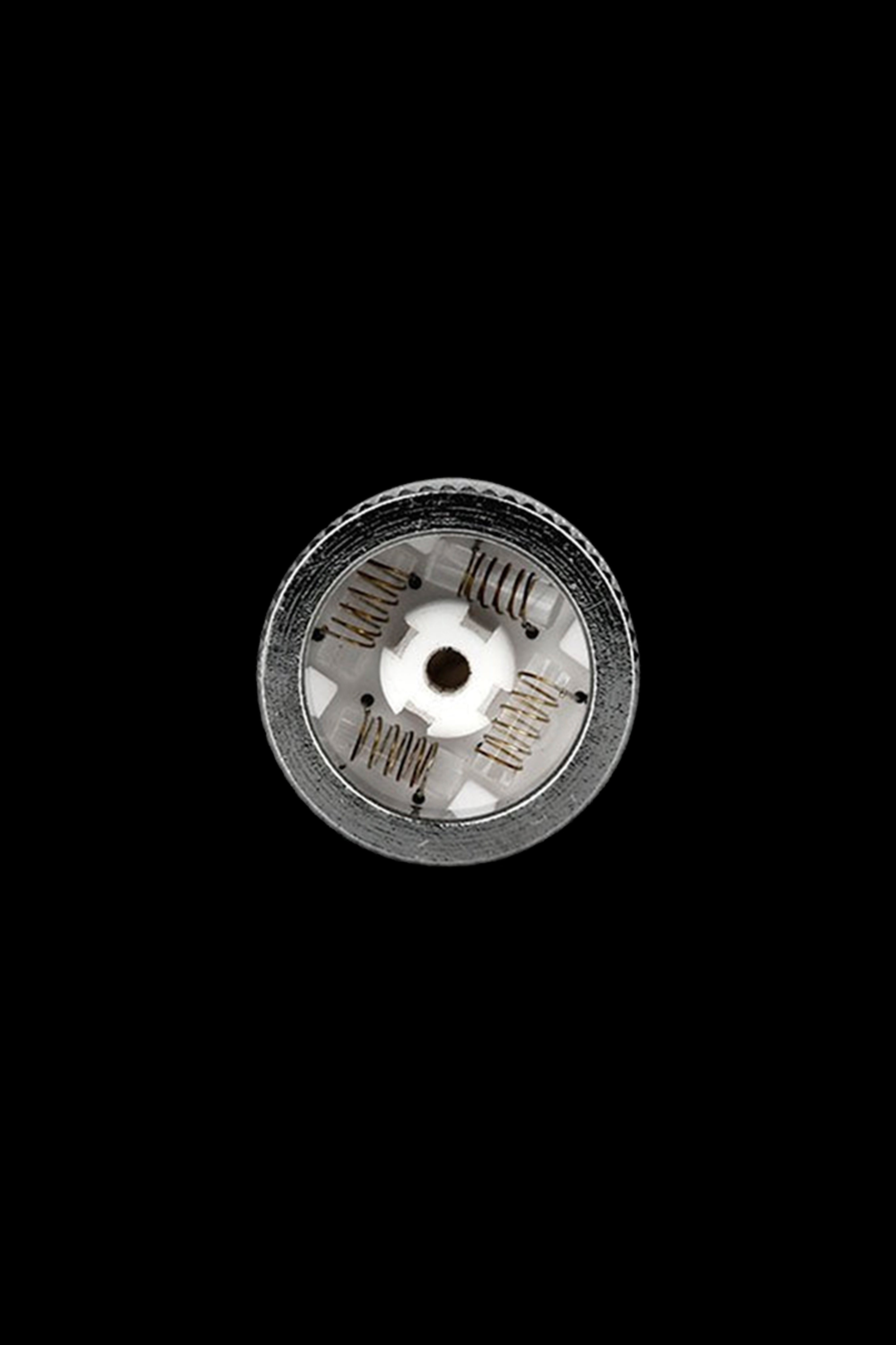 Metal cannabis coil for vaporizing, isolated on black.