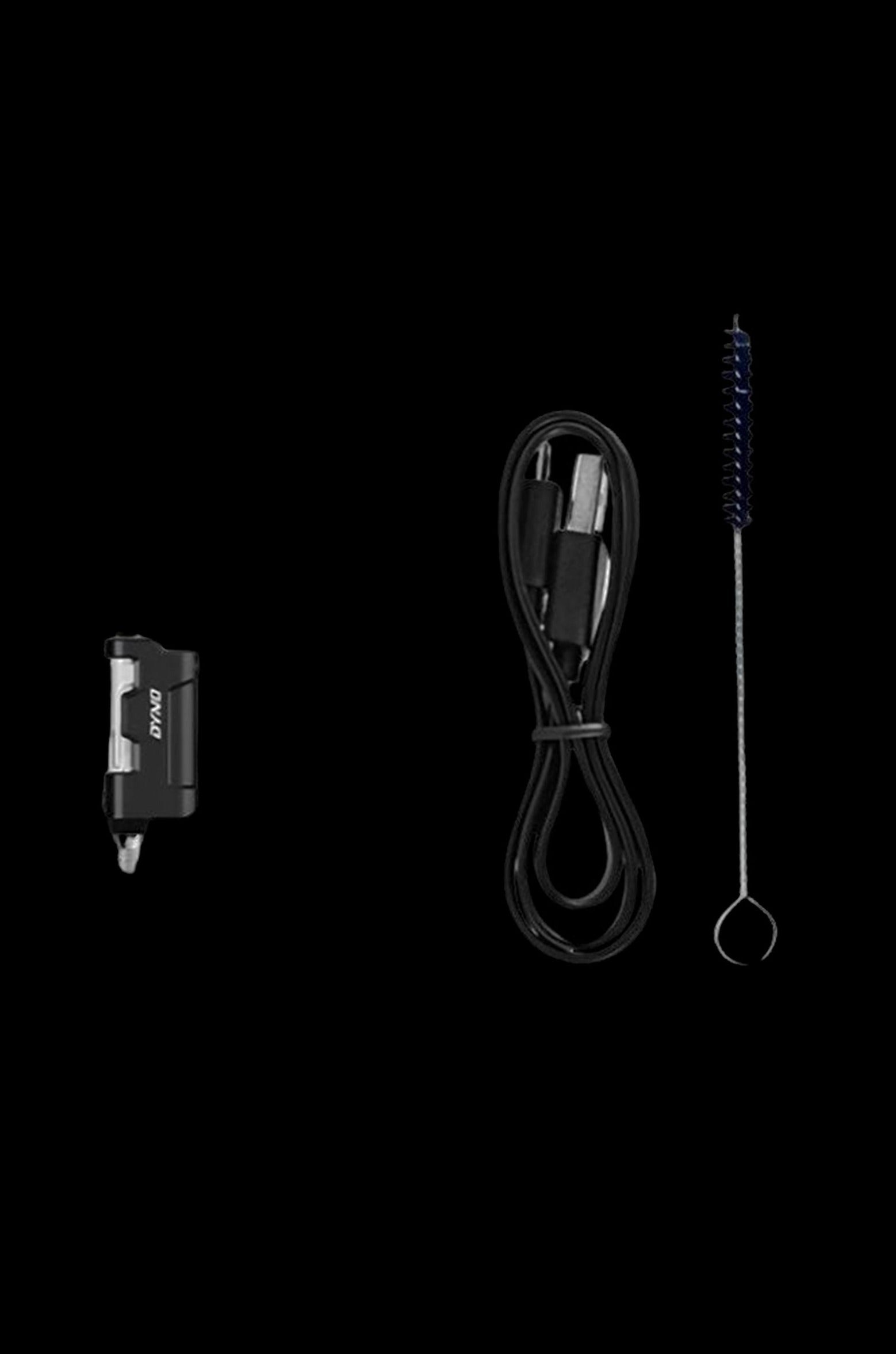 DynaVap “M” portable vaporizer pen, USB-C charging cable, and cleaning brush on a black background.