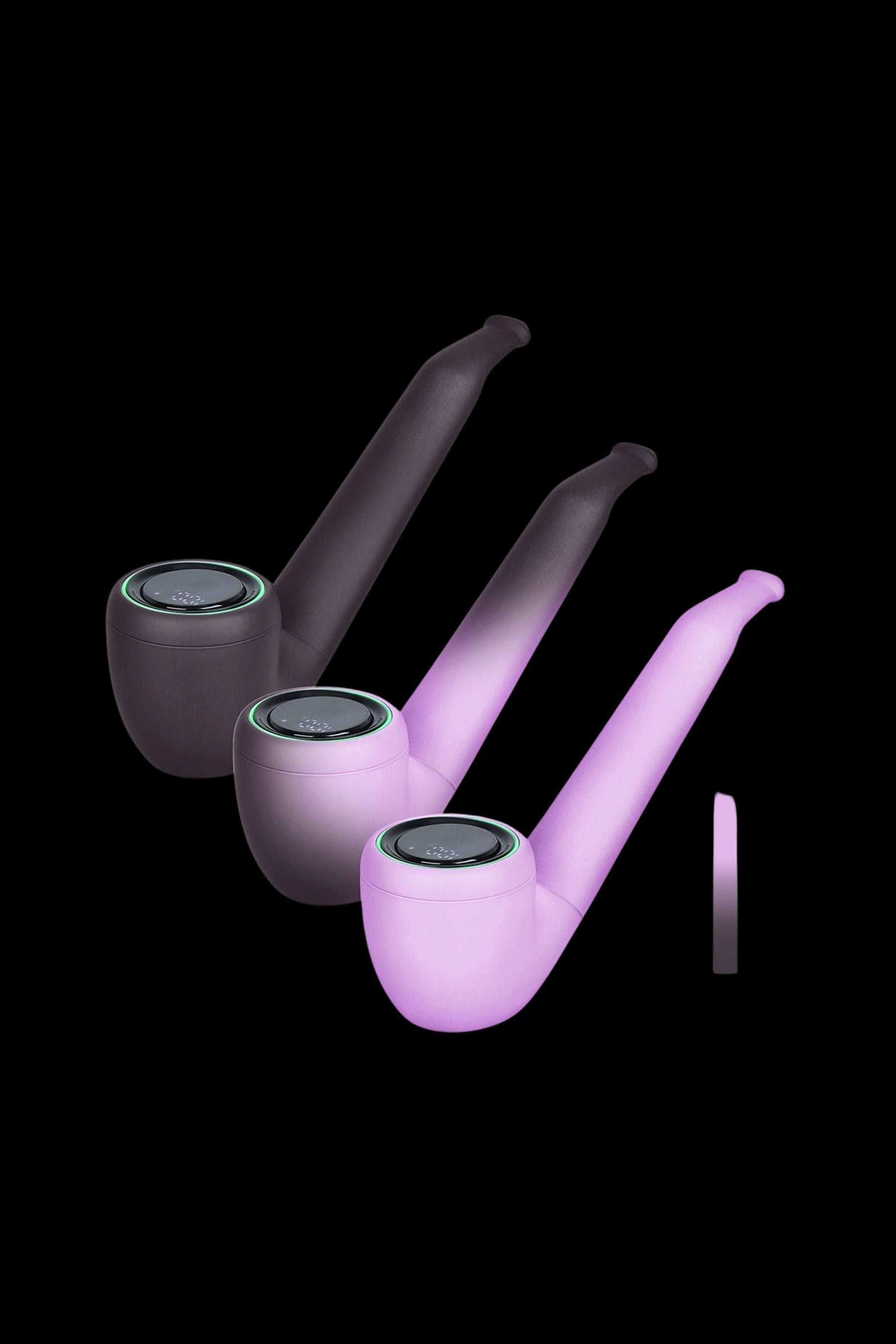 Sleek, black cannabis pipes with glowing green accents and translucent purple stems, displayed against a black background.