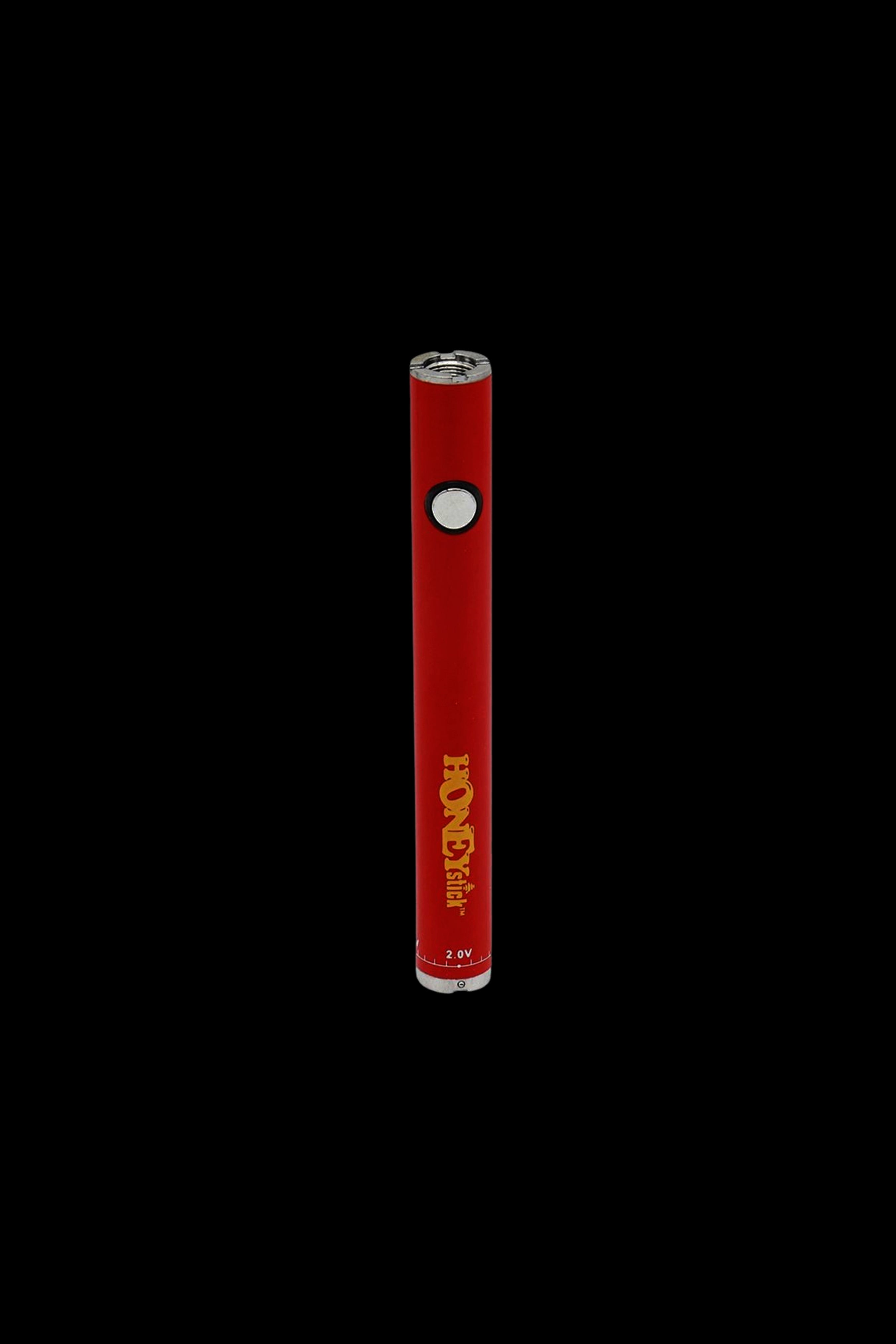 Red cannabis vape pen with “HoneyStick” branding against a black background.