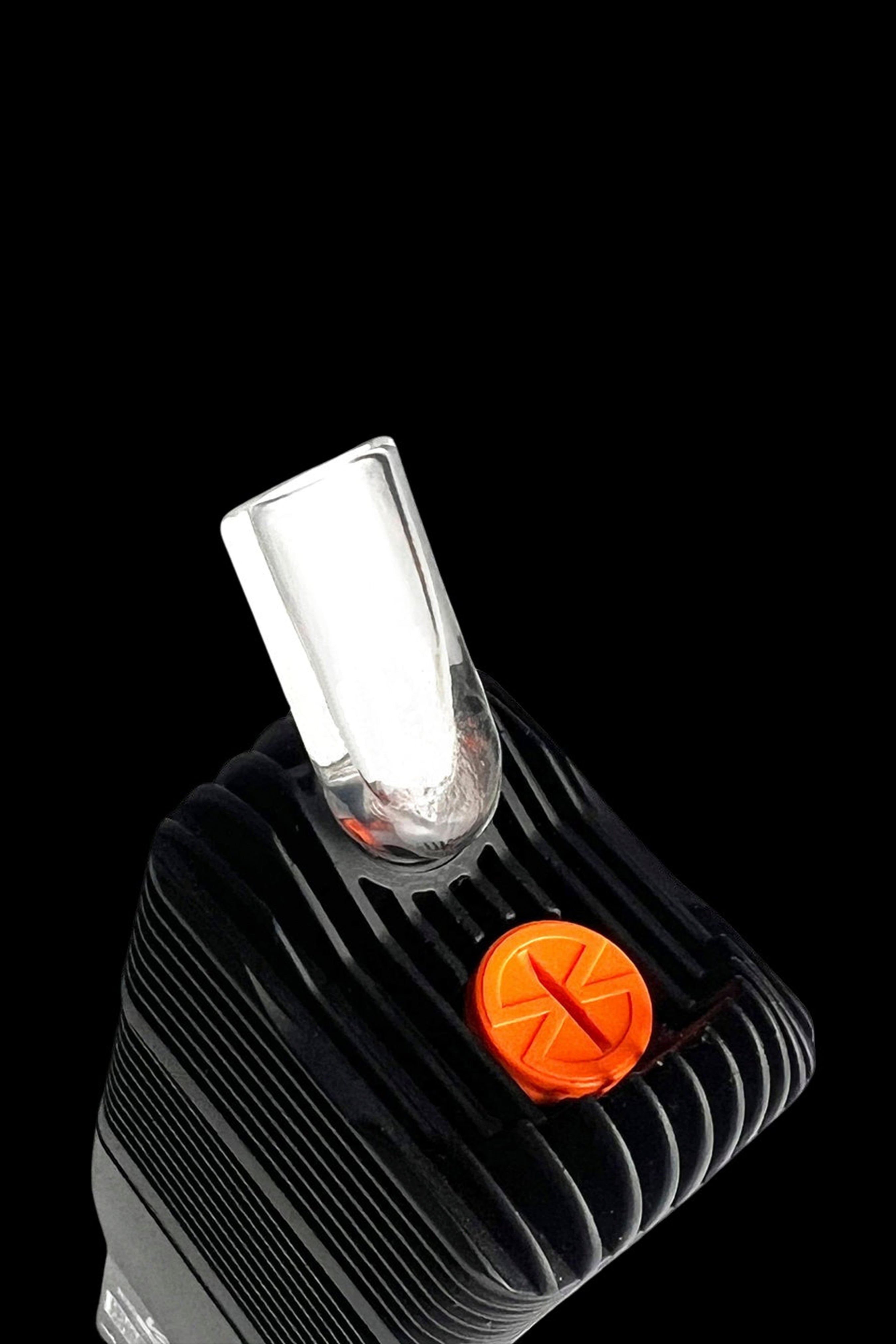Close-up of a black cannabis vaporizer with a clear glass mouthpiece and orange control button.