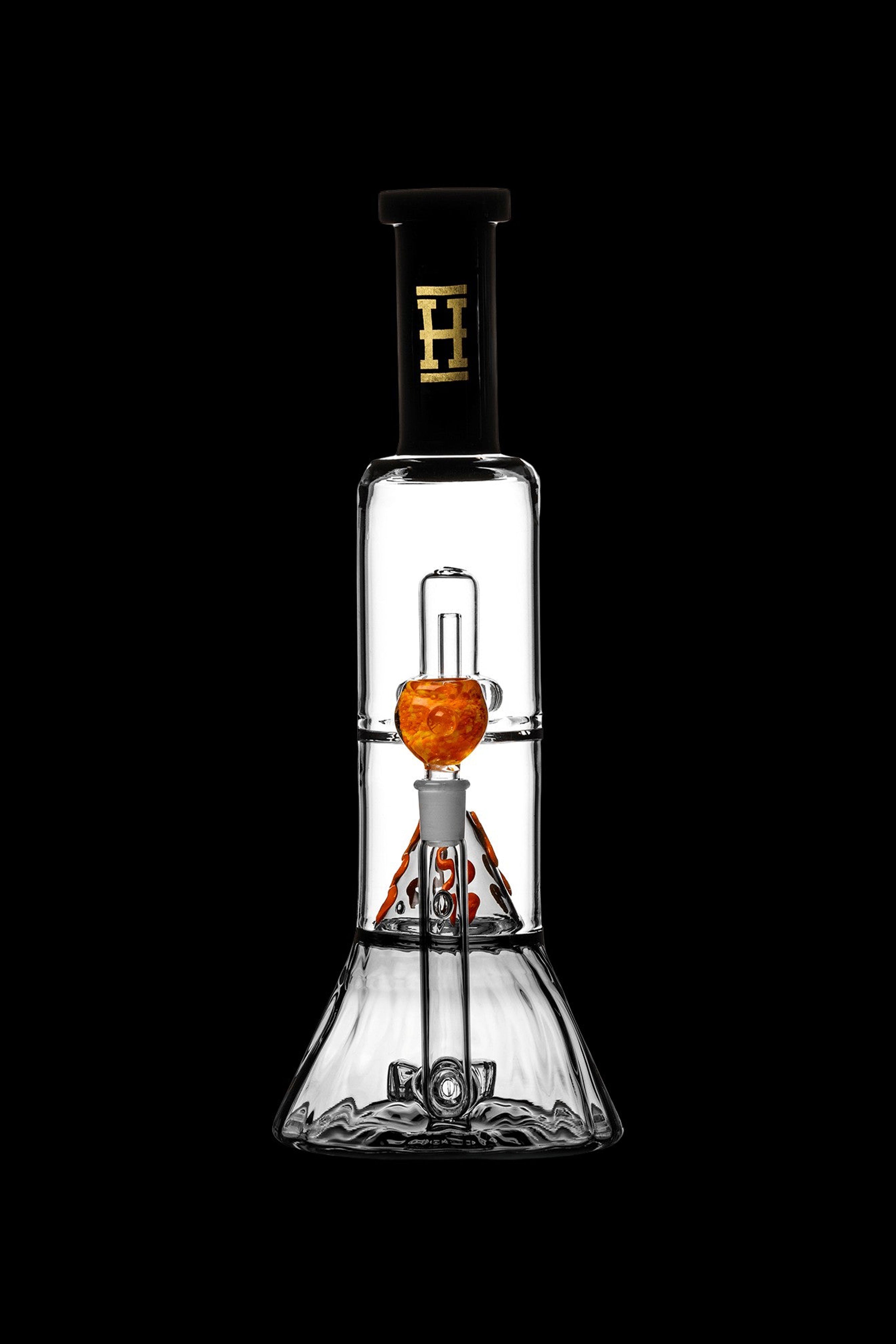 Clear glass water pipe (bong) with orange accents, studio shot on black.