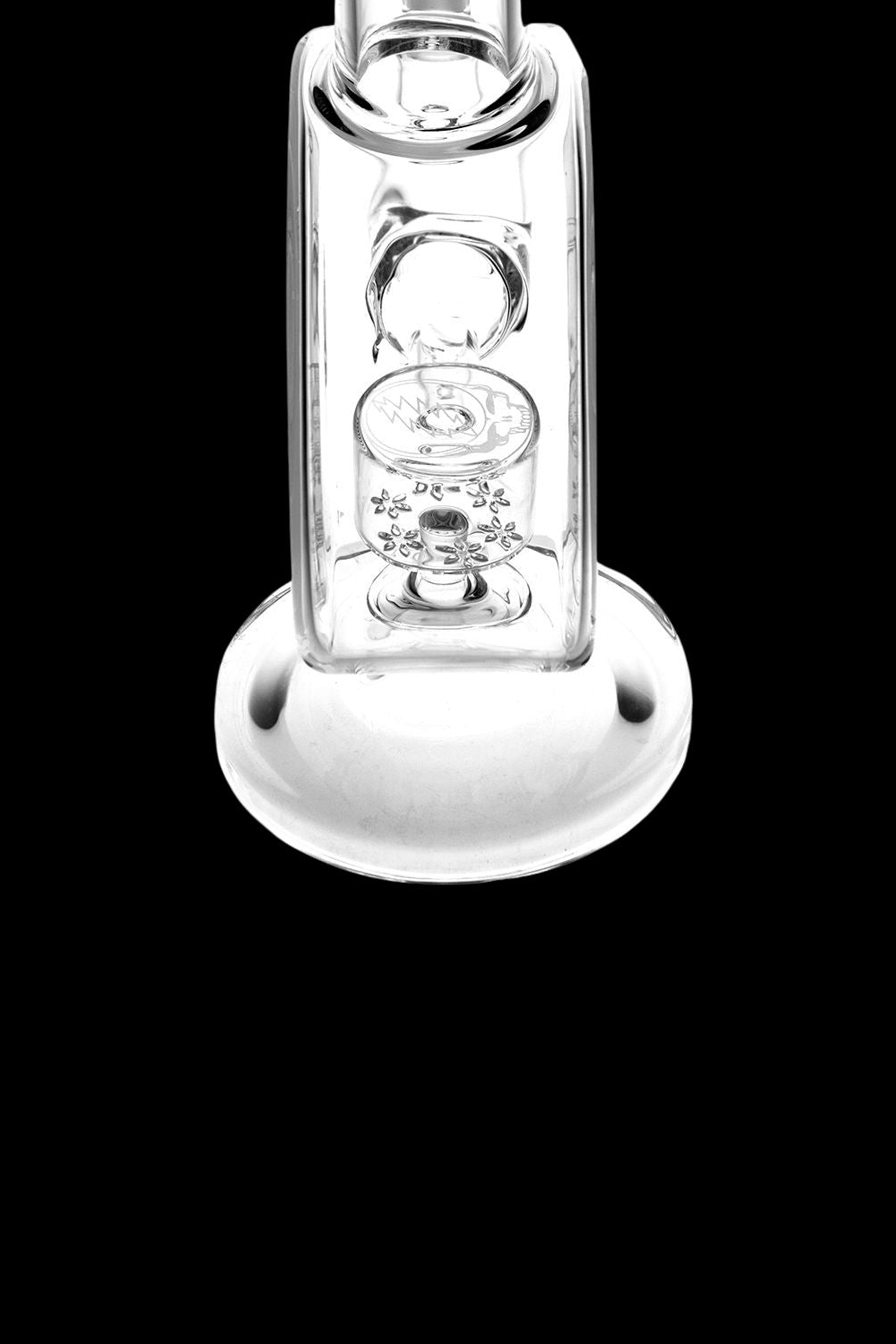 Clear glass water pipe (bong) with intricate floral-shaped percolator.