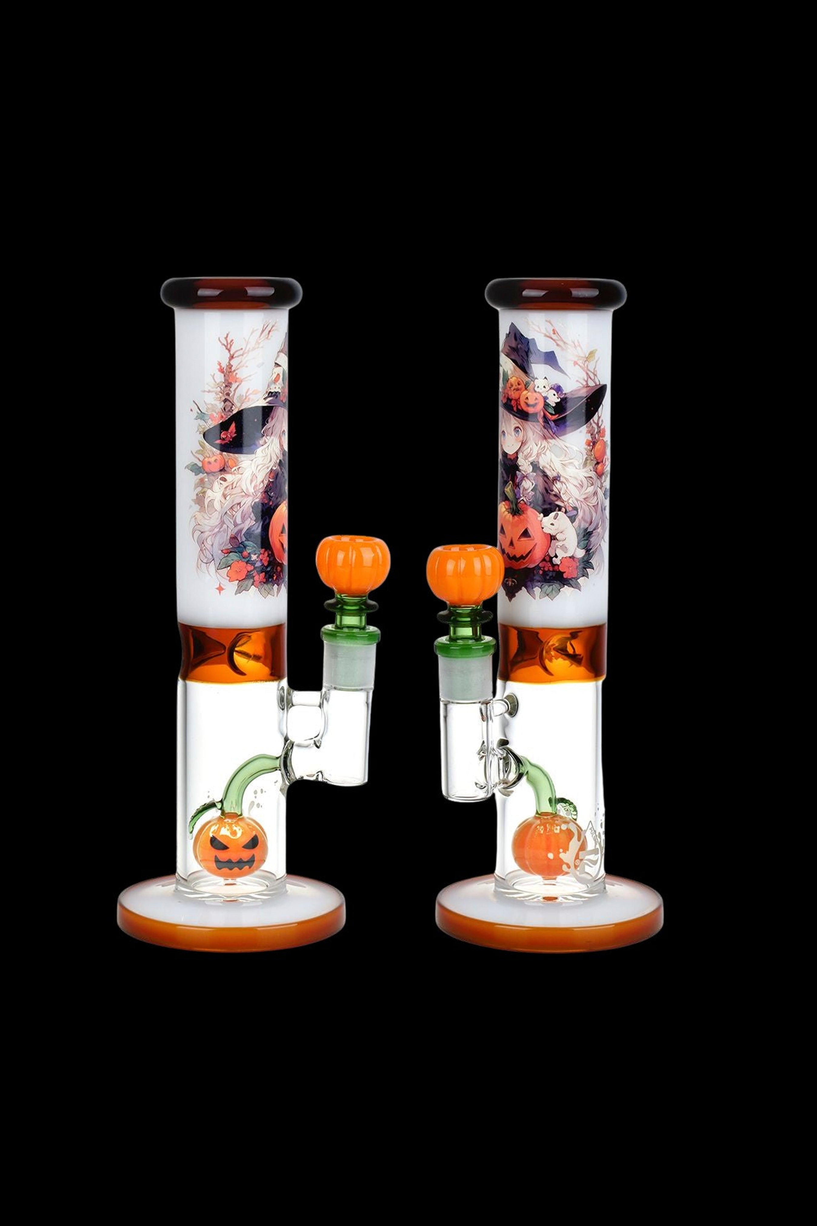 Two glass bongs with a Halloween theme, featuring jack-o'-lanterns and spooky illustrations against a black background.