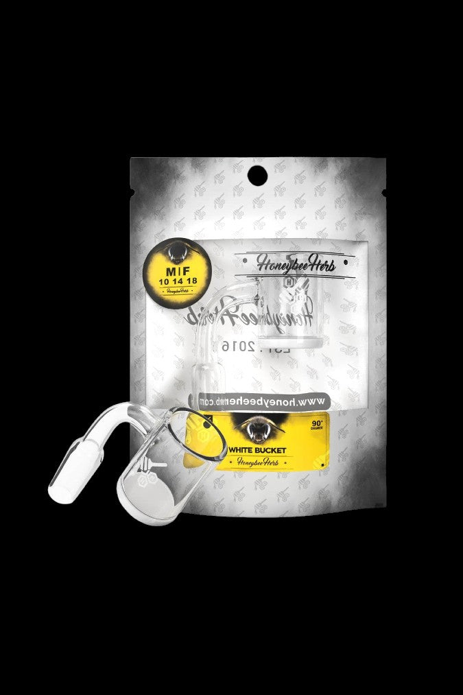 White packaging for "Honeybee Herbs" cannabis with a rolling tray and rolling papers beside it.