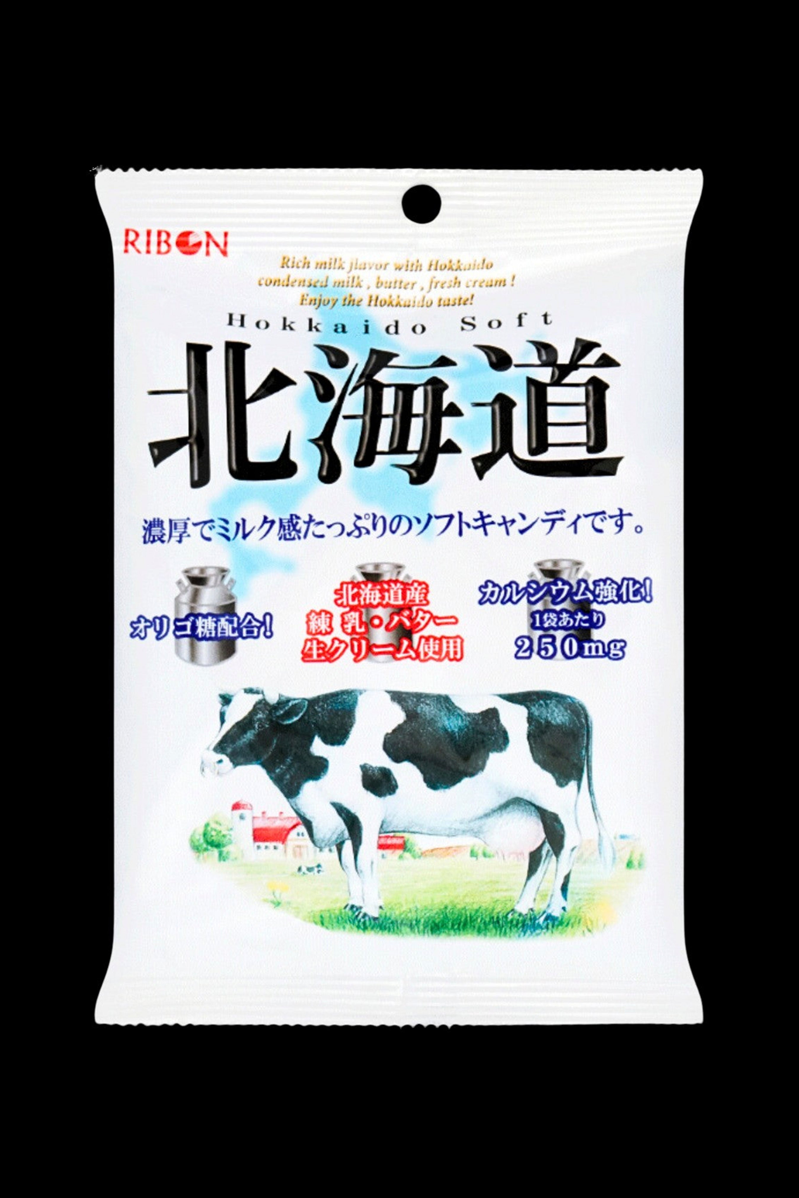 A white candy wrapper featuring a Holstein cow and Japanese text, advertising “Hokkaido Soft” with a 250mg cannabis dosage indicated.