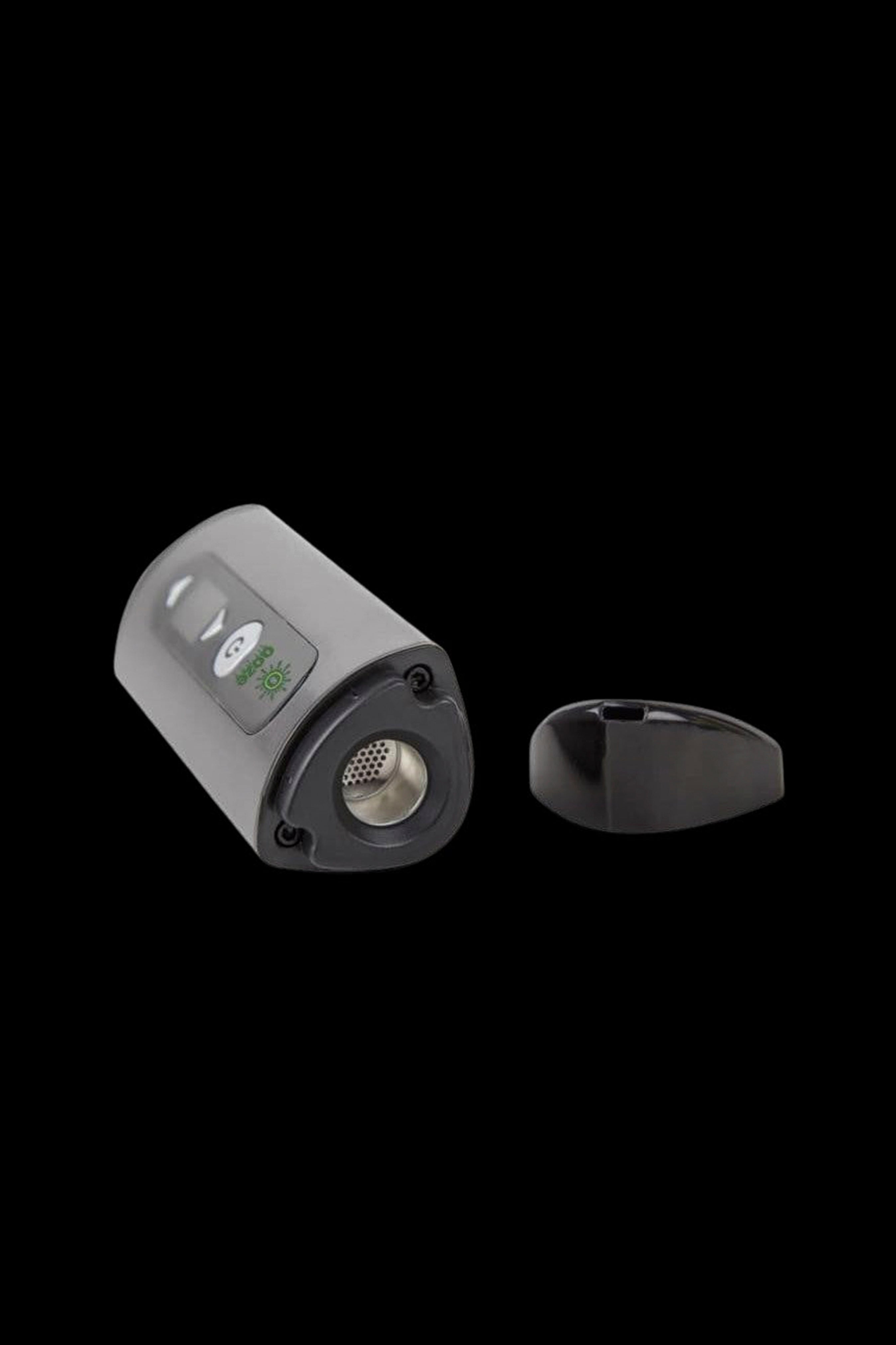Portable cannabis vaporizer with open loading chamber.
