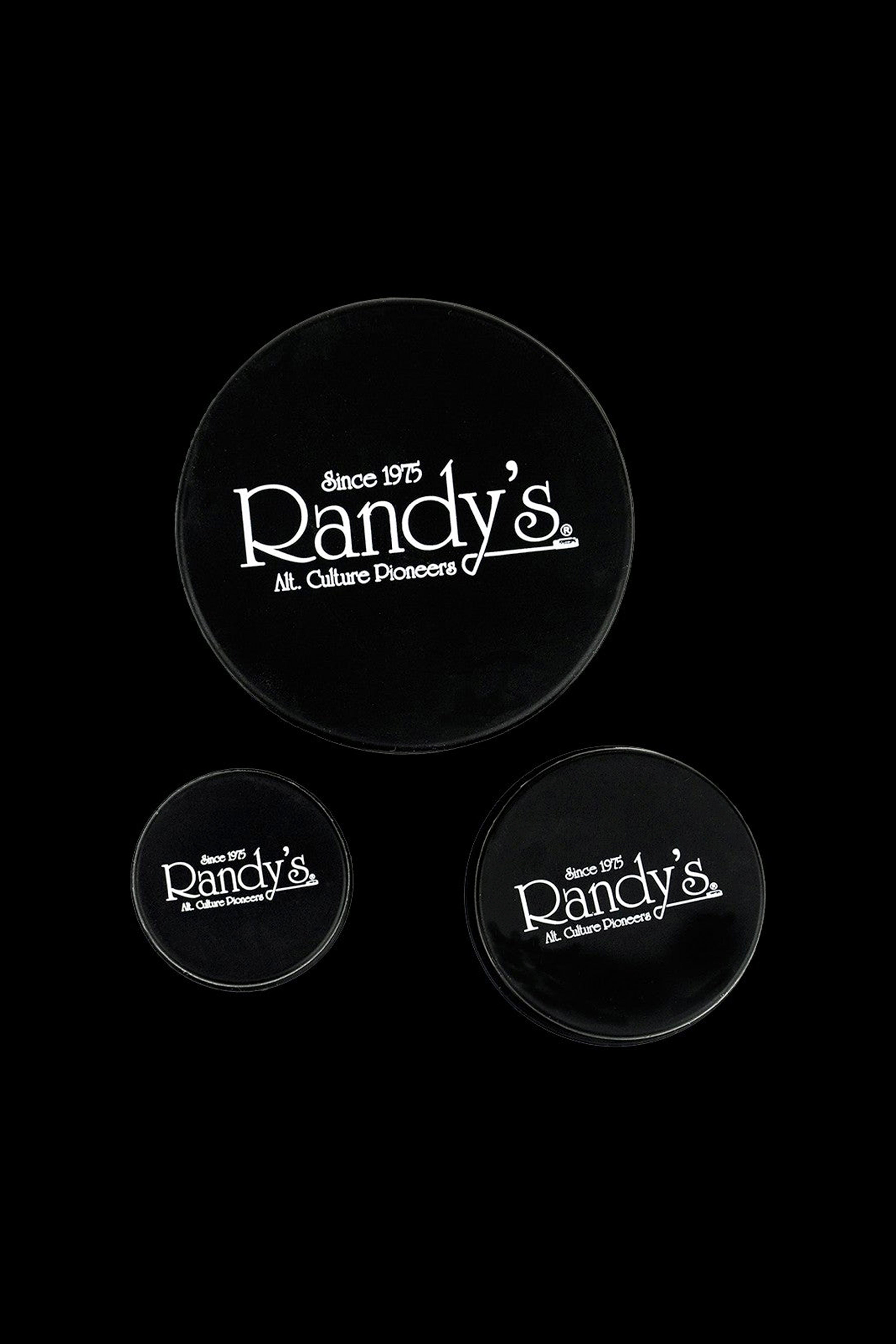 Black ashtrays displaying the white “Randy's – Since 1975 – Alt. Culture Pioneers” logo.