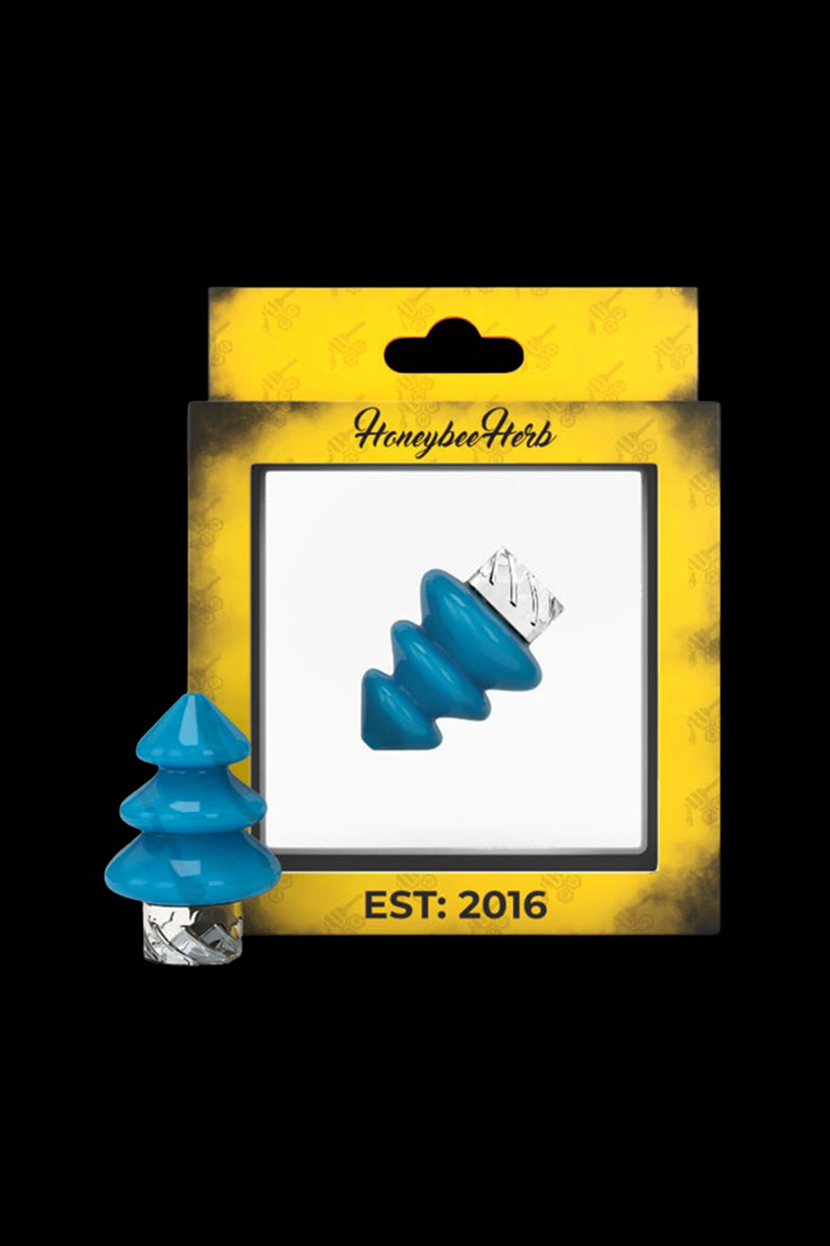 Blue cannabis concentrate resembling a Christmas tree, packaged on a gold card with “Honeybee Herb” branding and “Est. 2016”.