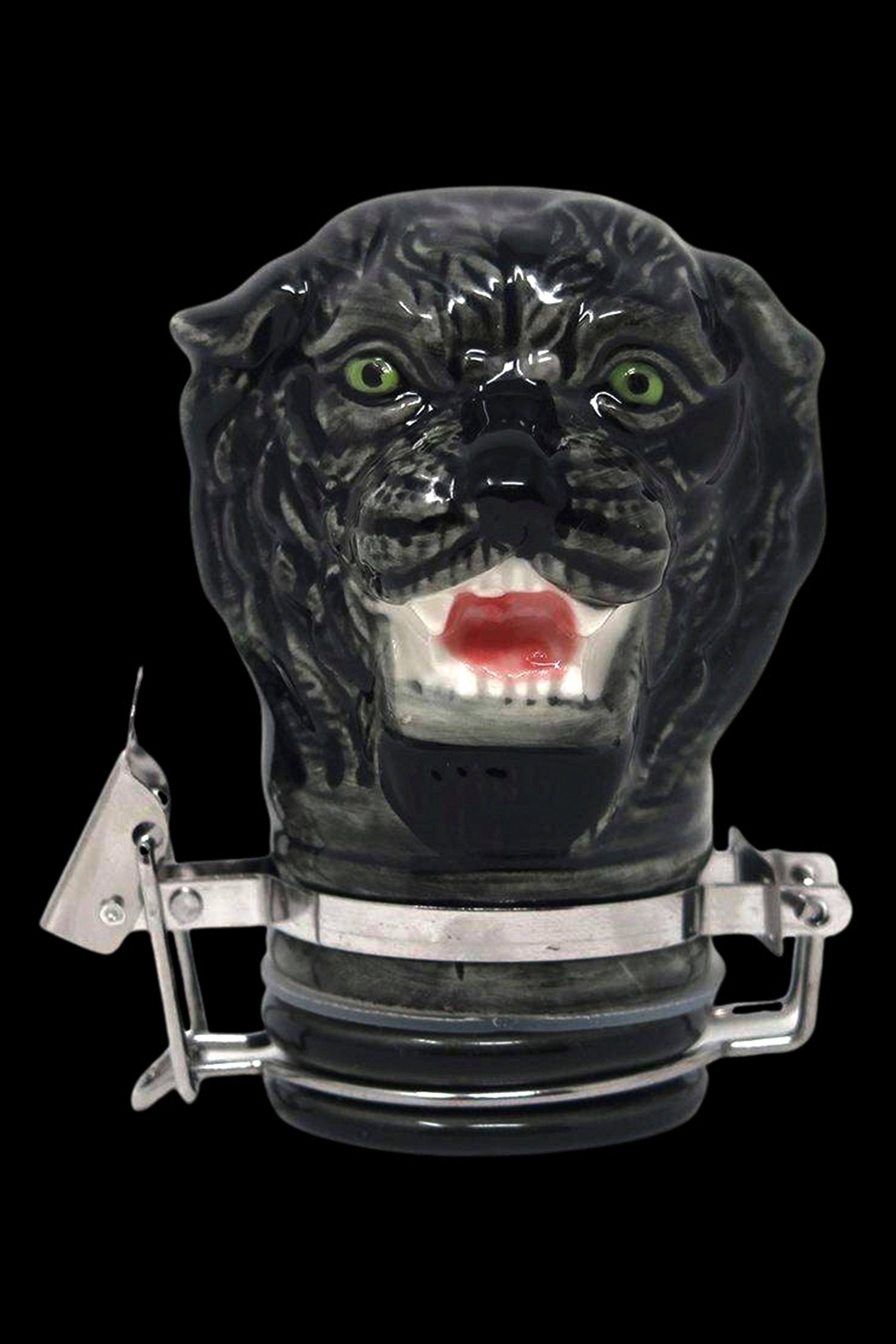 Black panther-shaped water pipe with metallic clamps and a red mouthpiece, isolated on a black background.