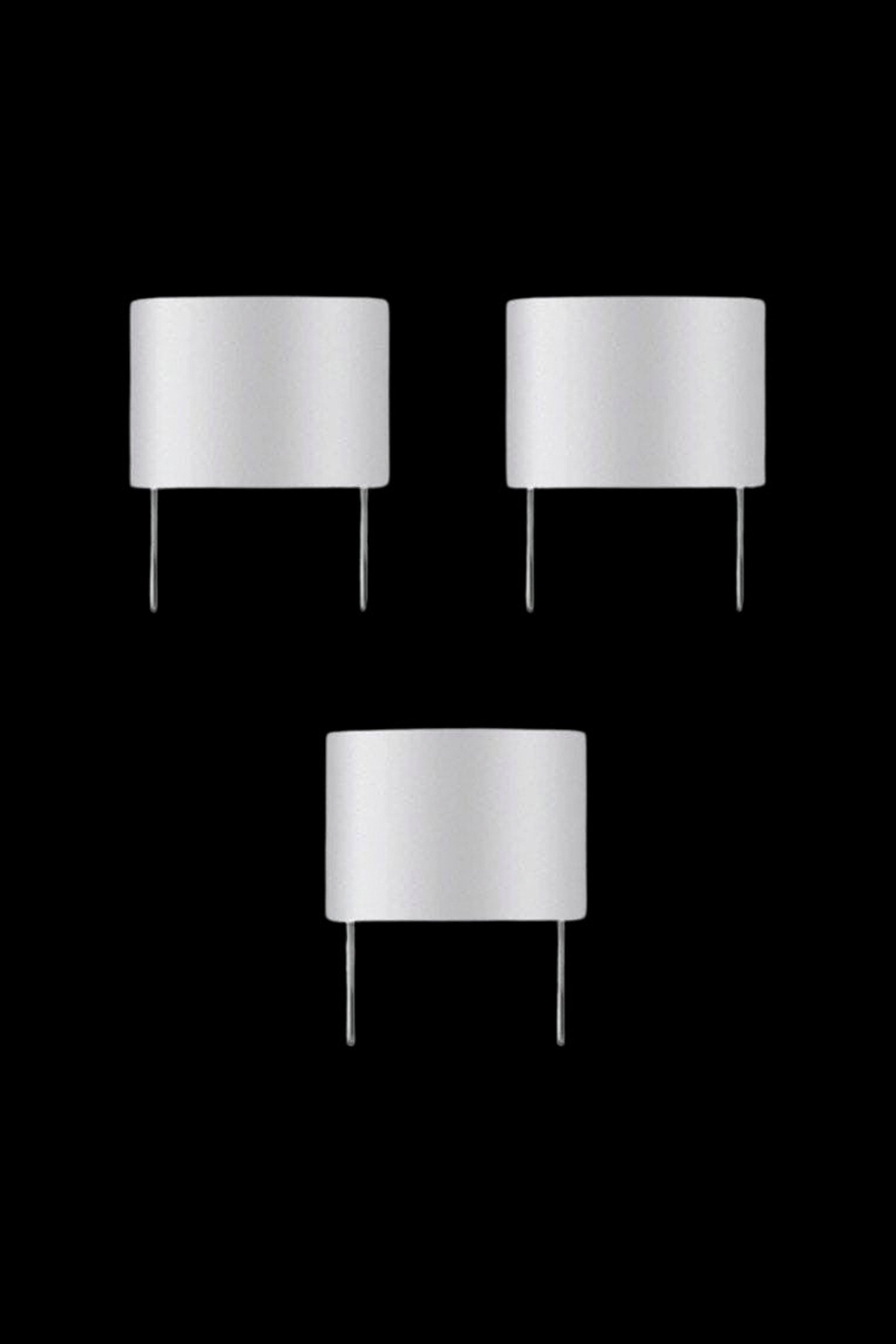 Silver cannabis rosin press plates on black background.