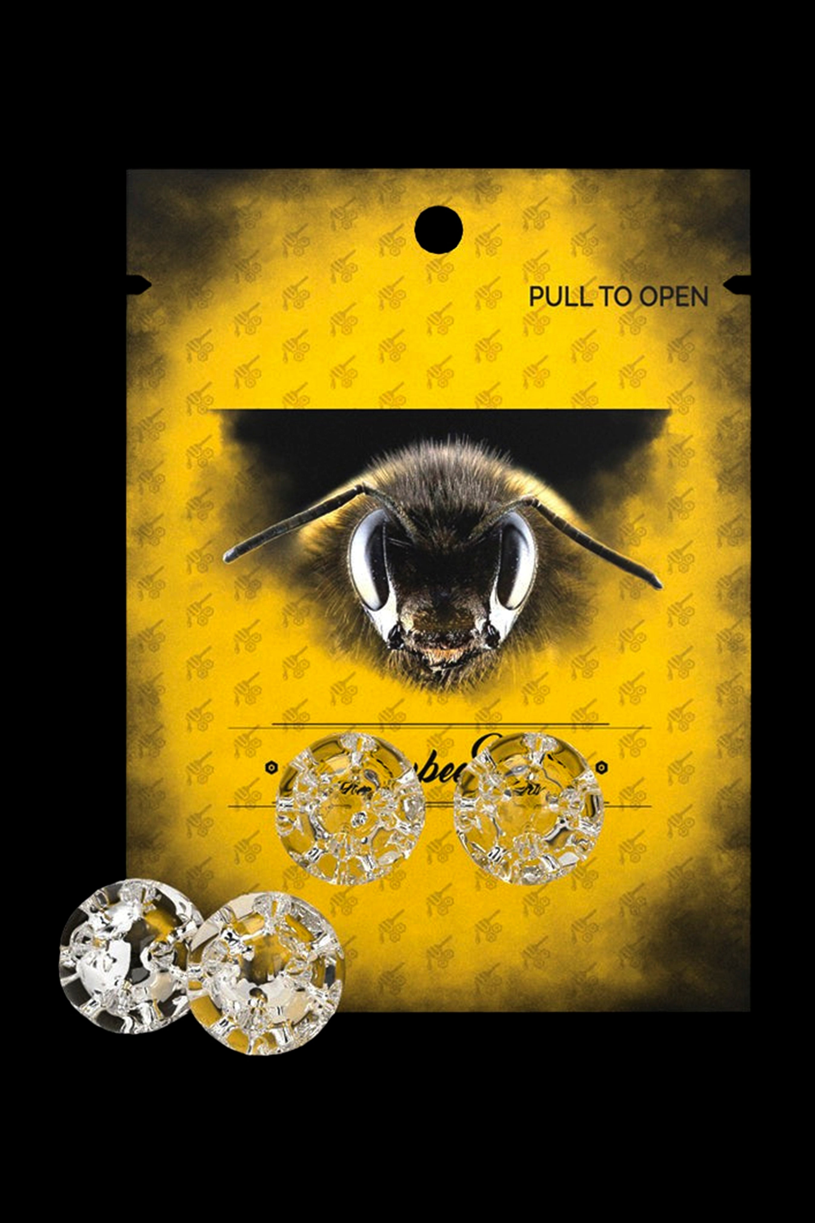 Yellow cannabis accessory packaging featuring a bee and diamond-shaped contents.