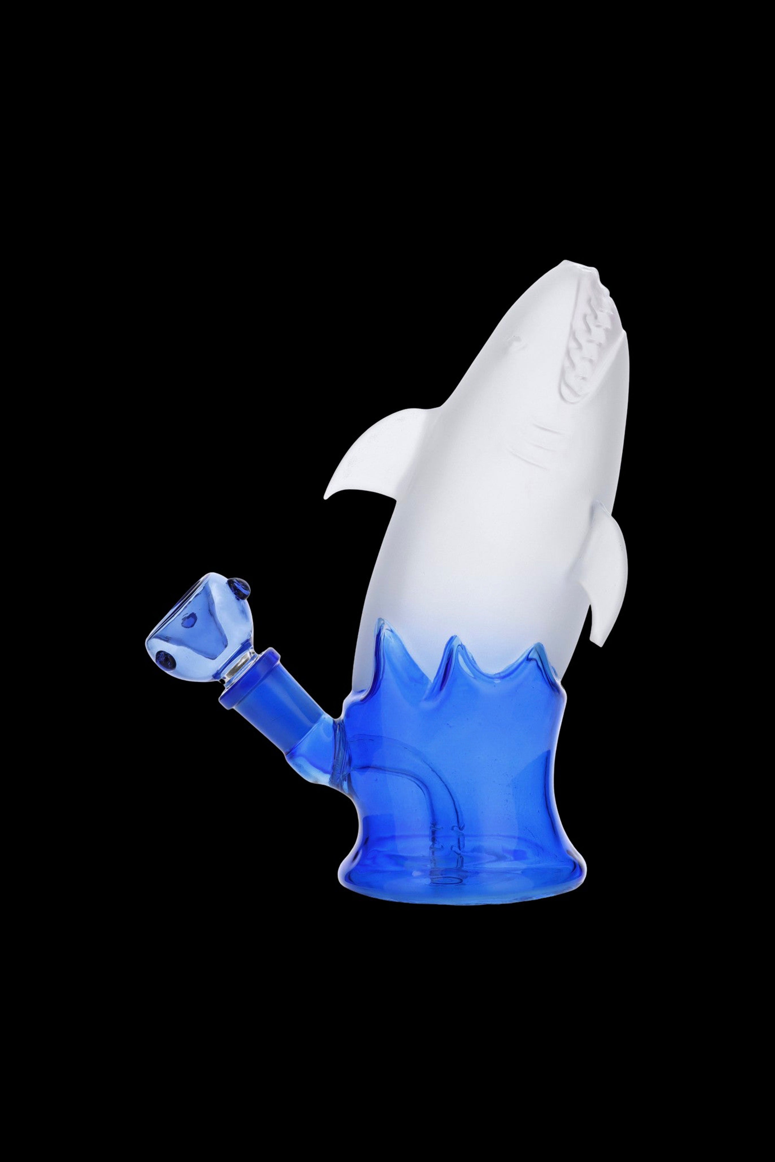 Glass water pipe shaped like a shark with blue and white coloring.