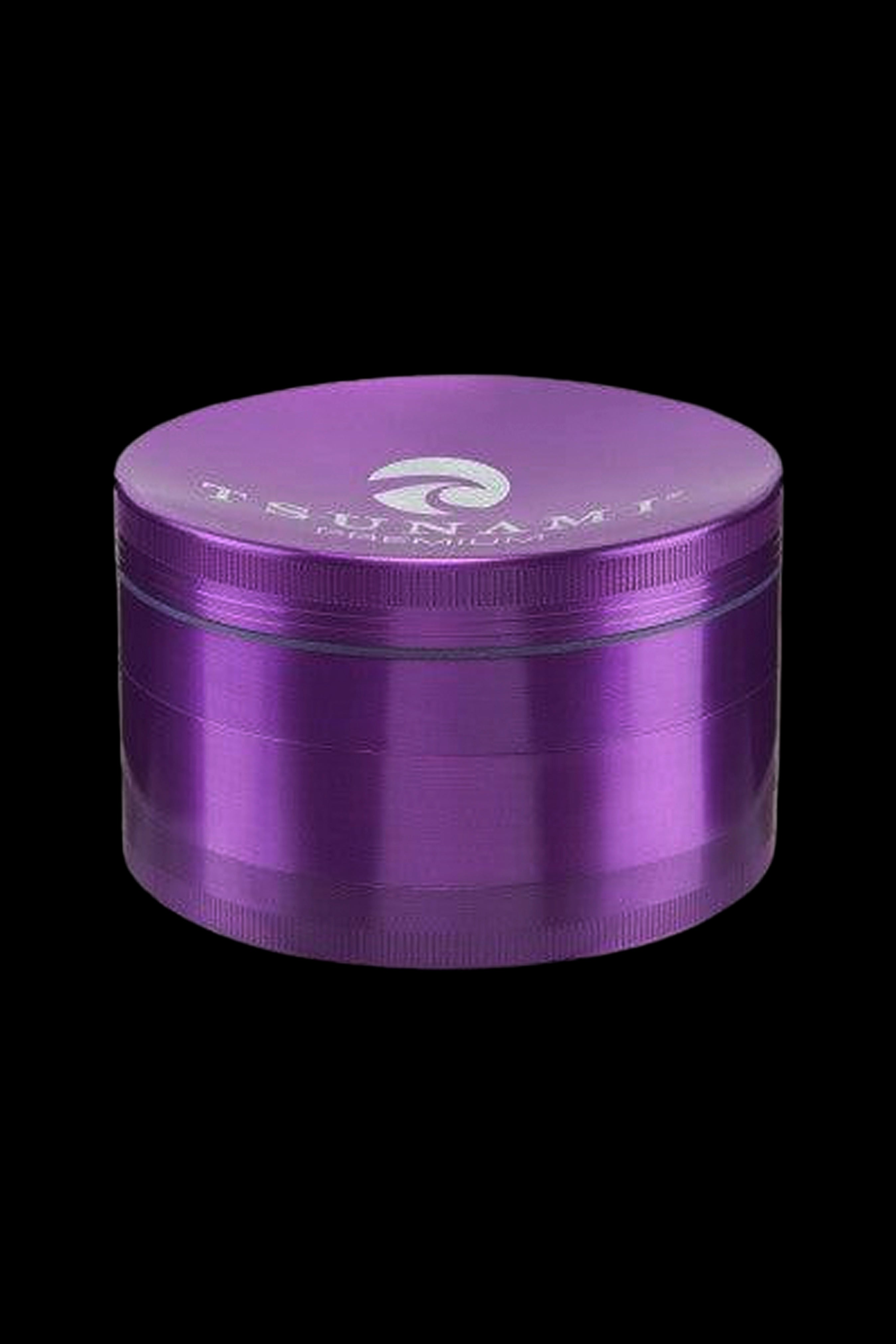 Purple four-piece metal grinder for cannabis.