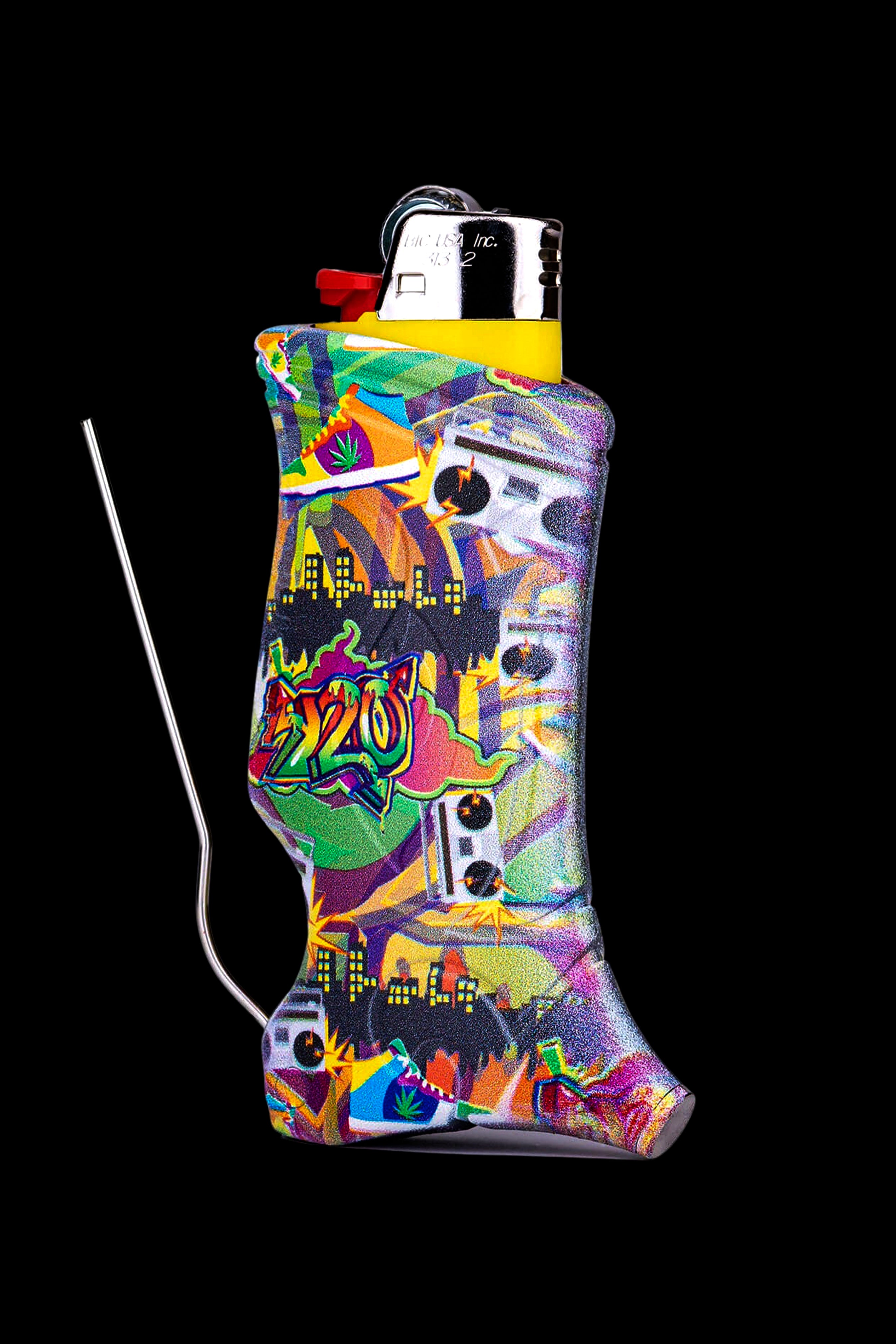 A colorful, patterned lighter sleeve covering a silver lighter with a metal cleaning tool alongside it, against a black background.