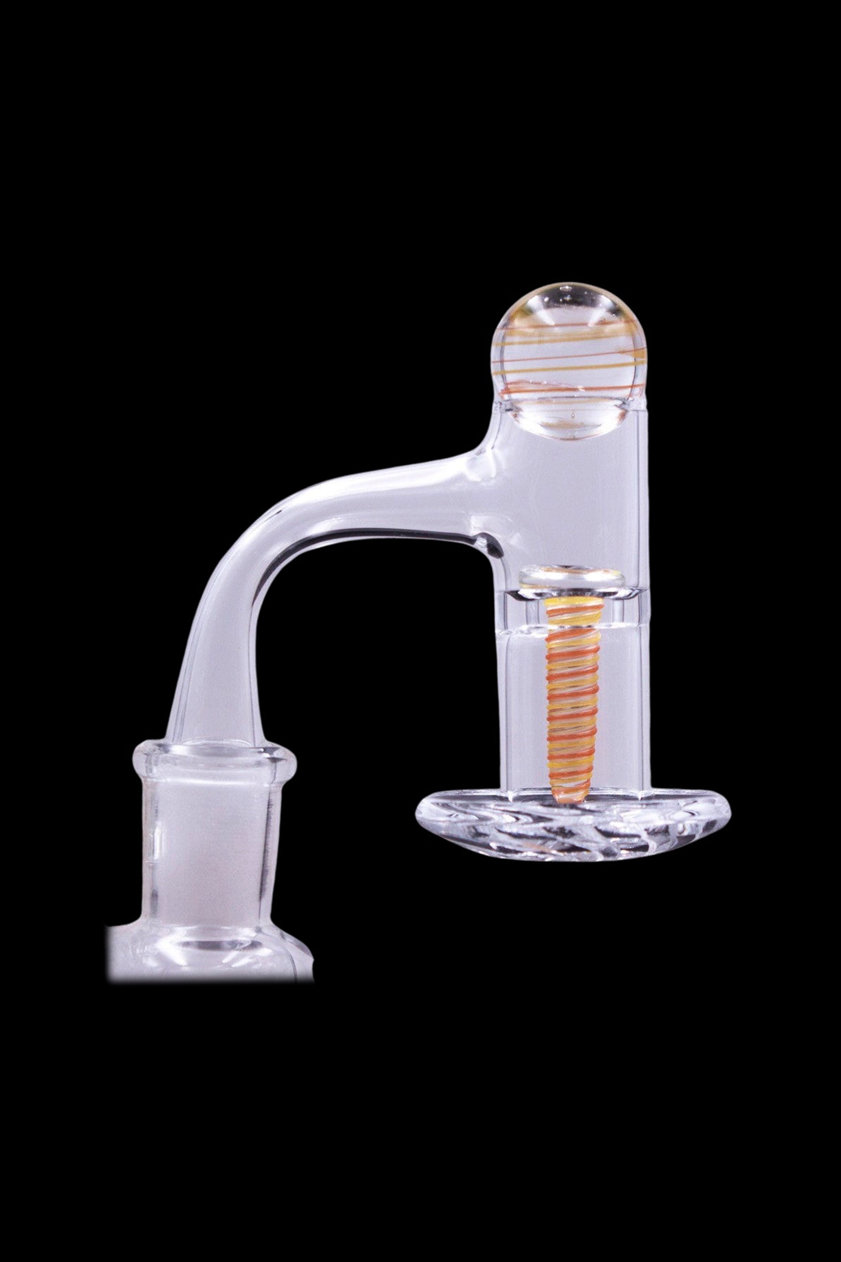 Clear glass dab rig with orange and white spiral accents, isolated on black.