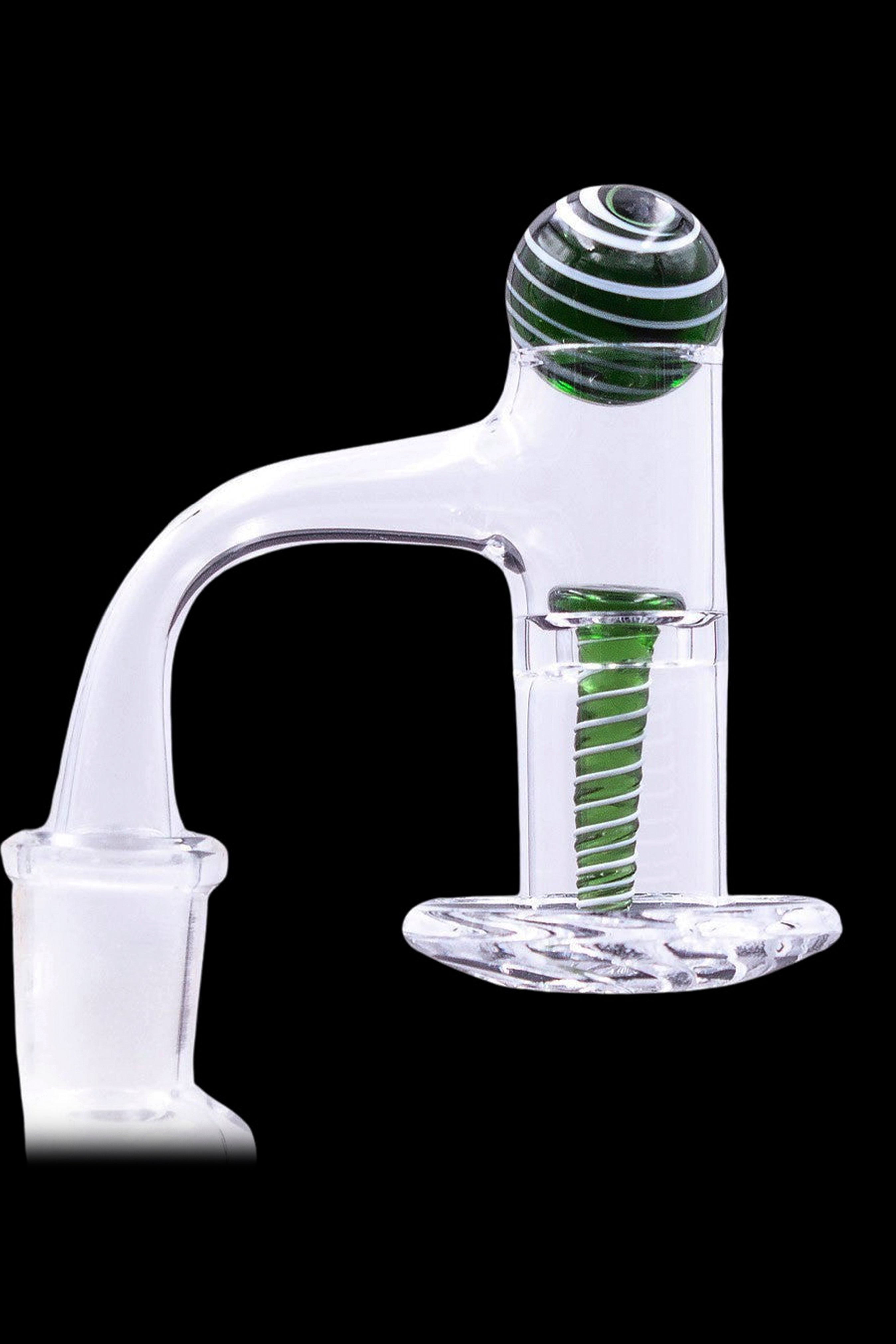 Clear glass oil rig carb cap with green accents.