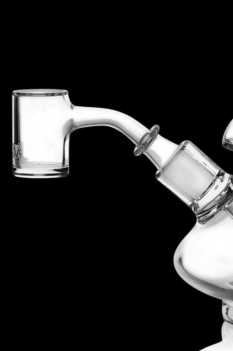 Clear glass dab rig with a quartz banger.