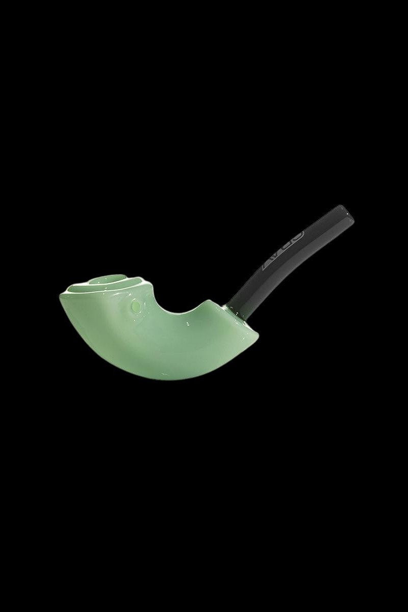 Green glass pipe with a black mouthpiece against a black background.